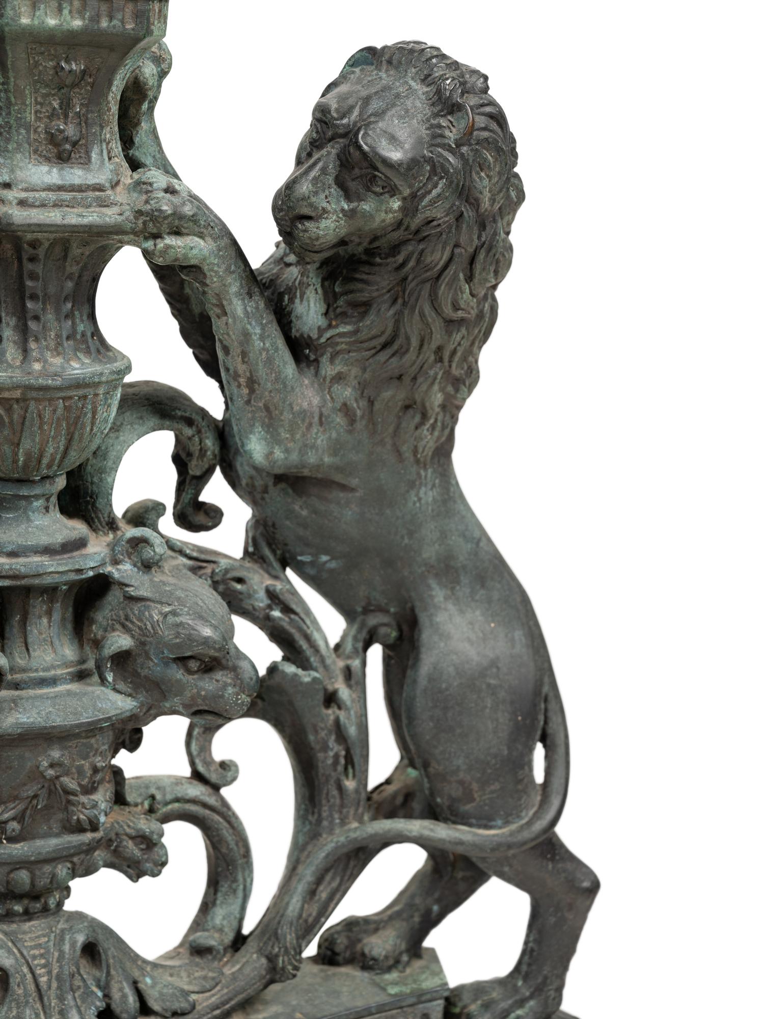 A Pair of Continental Cast Metal Andirons
