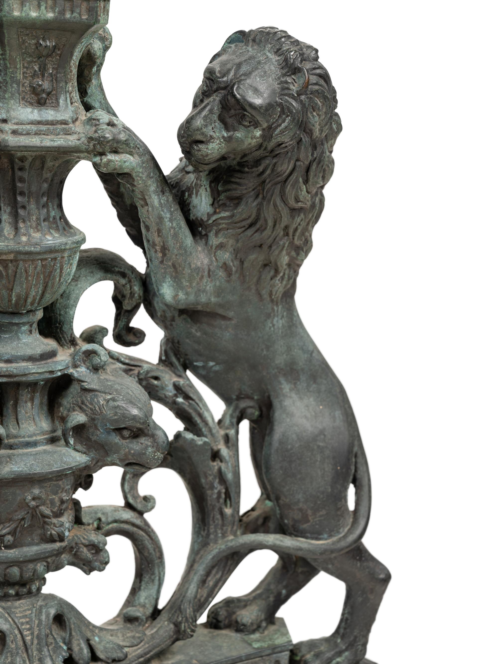 A Pair of Continental Cast Metal Andirons