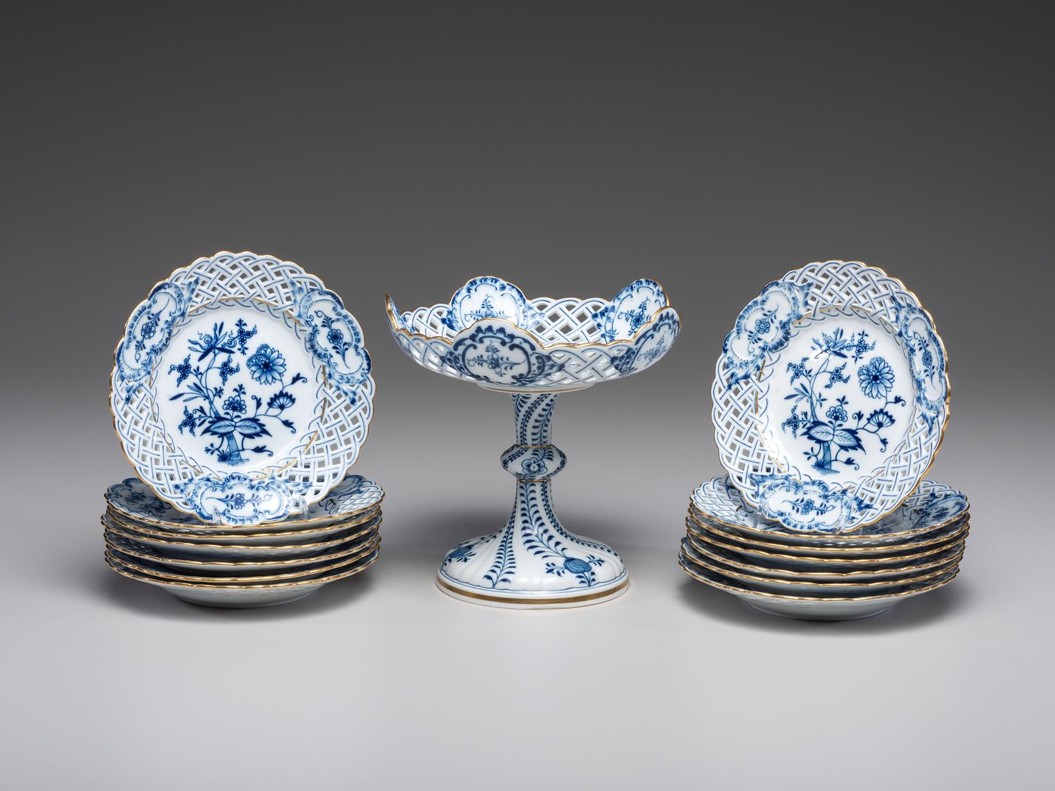 Fourteen Meissen ' Blue Onion' Reticulated Porcelain Plates