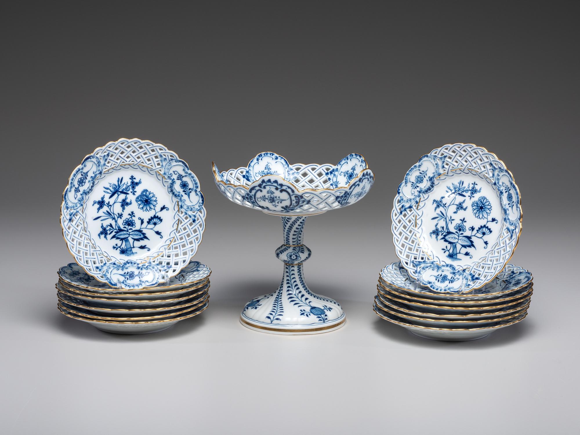 Fourteen Meissen ' Blue Onion' Reticulated Porcelain Plates