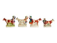 A Collection of Twelve Staffordshire Pottery Figures and Figural Wares