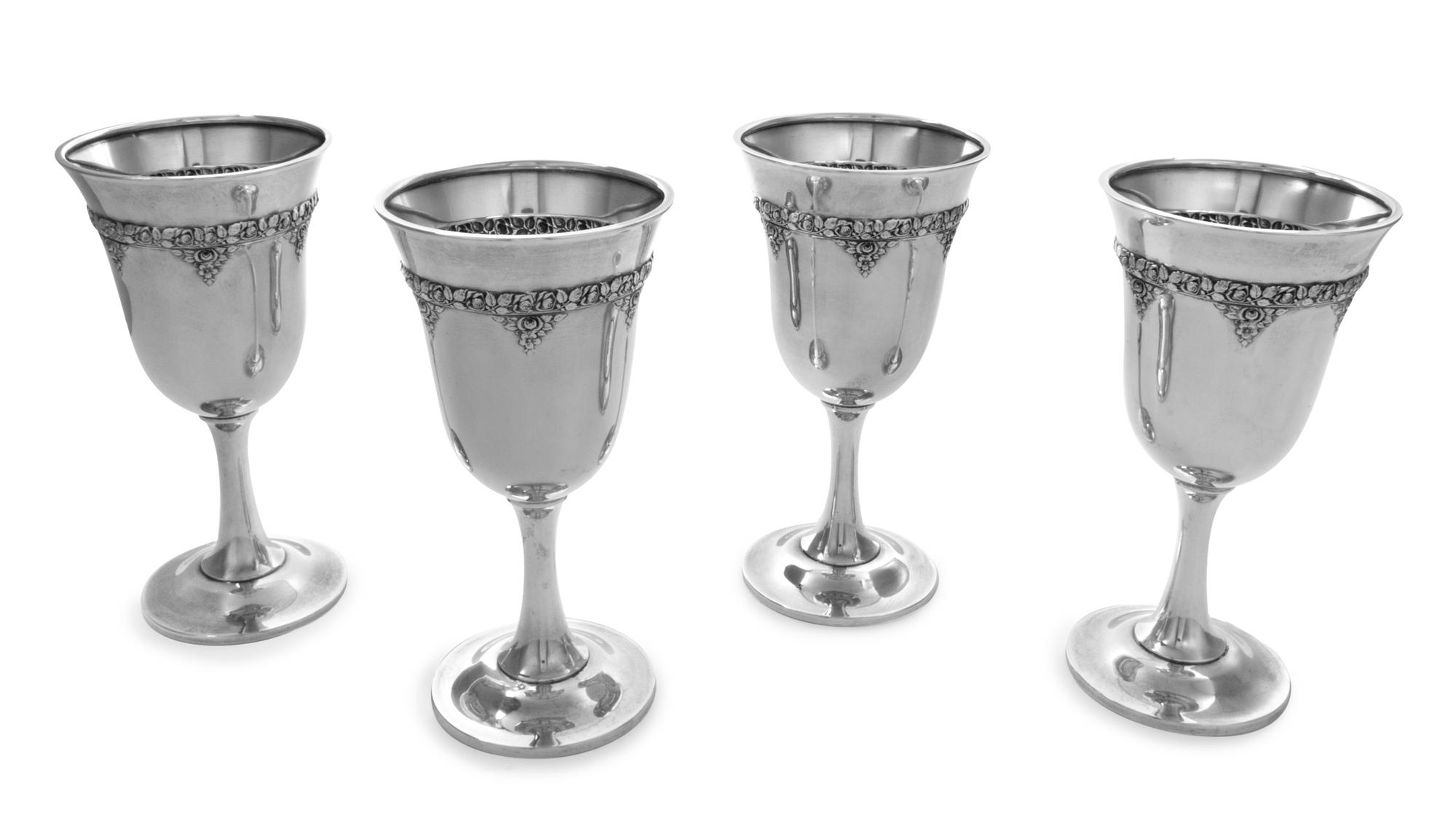 A Set of Four American Silver Water Goblets, R. Wallace & Sons Mfg. Co., Wallingford, CT, each having a floral and foliate decorated ba