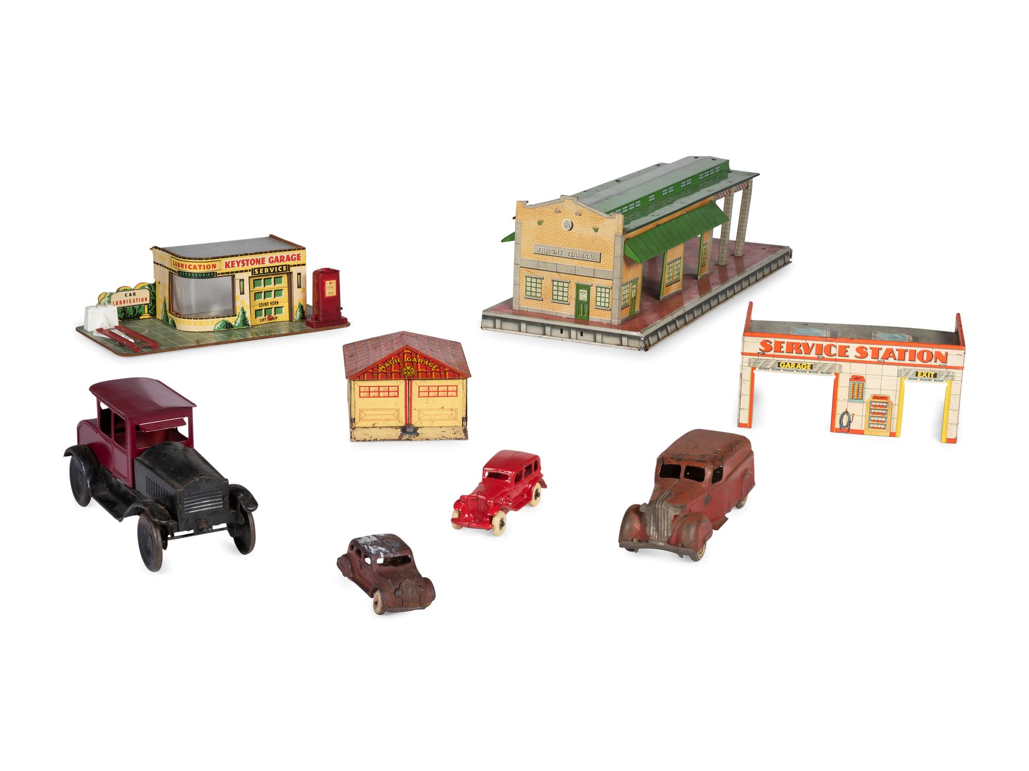 A Group of Toy Service Stations and Cars
