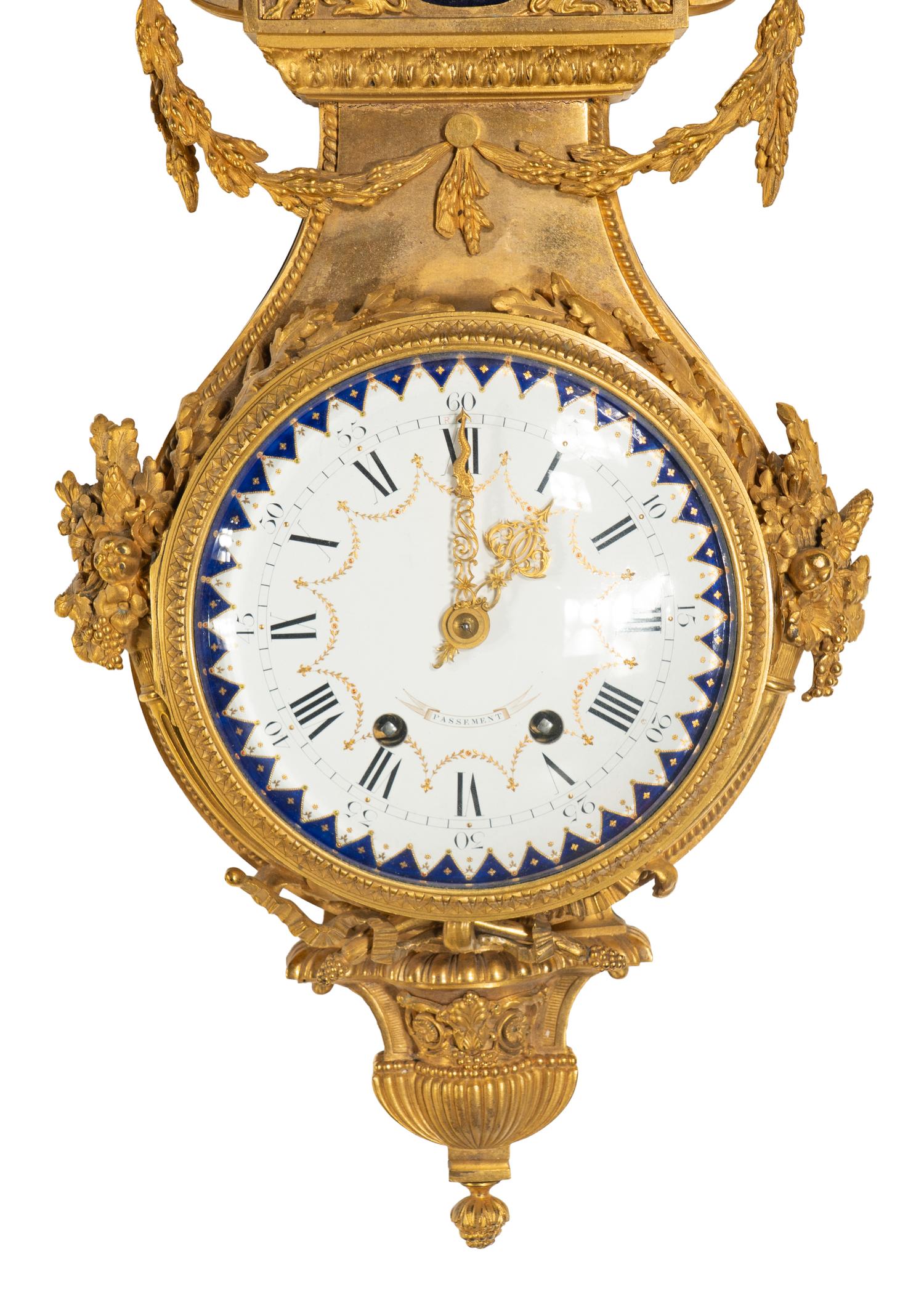 A French Gilt Bronze, Blue Steel, and Enamel Cartel d'Applique and Barometer
