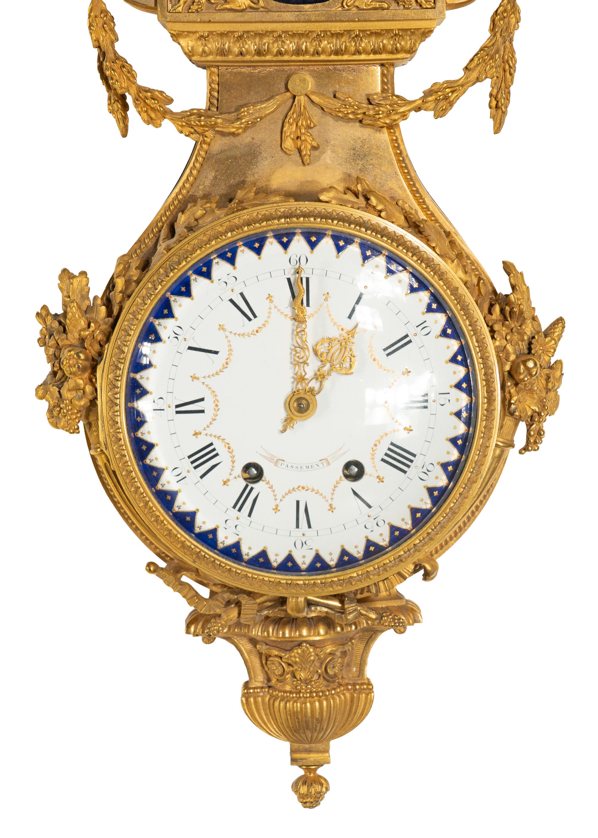 A French Gilt Bronze, Blue Steel, and Enamel Cartel d'Applique and Barometer