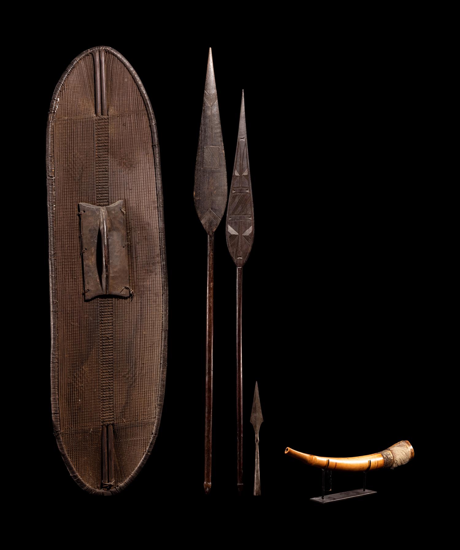 A Ngombe Wicket Shield with Three Spears and a Mbiu Horn