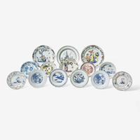 A collection of fourteen English Delft or tin-glazed earthenware plates 18th century