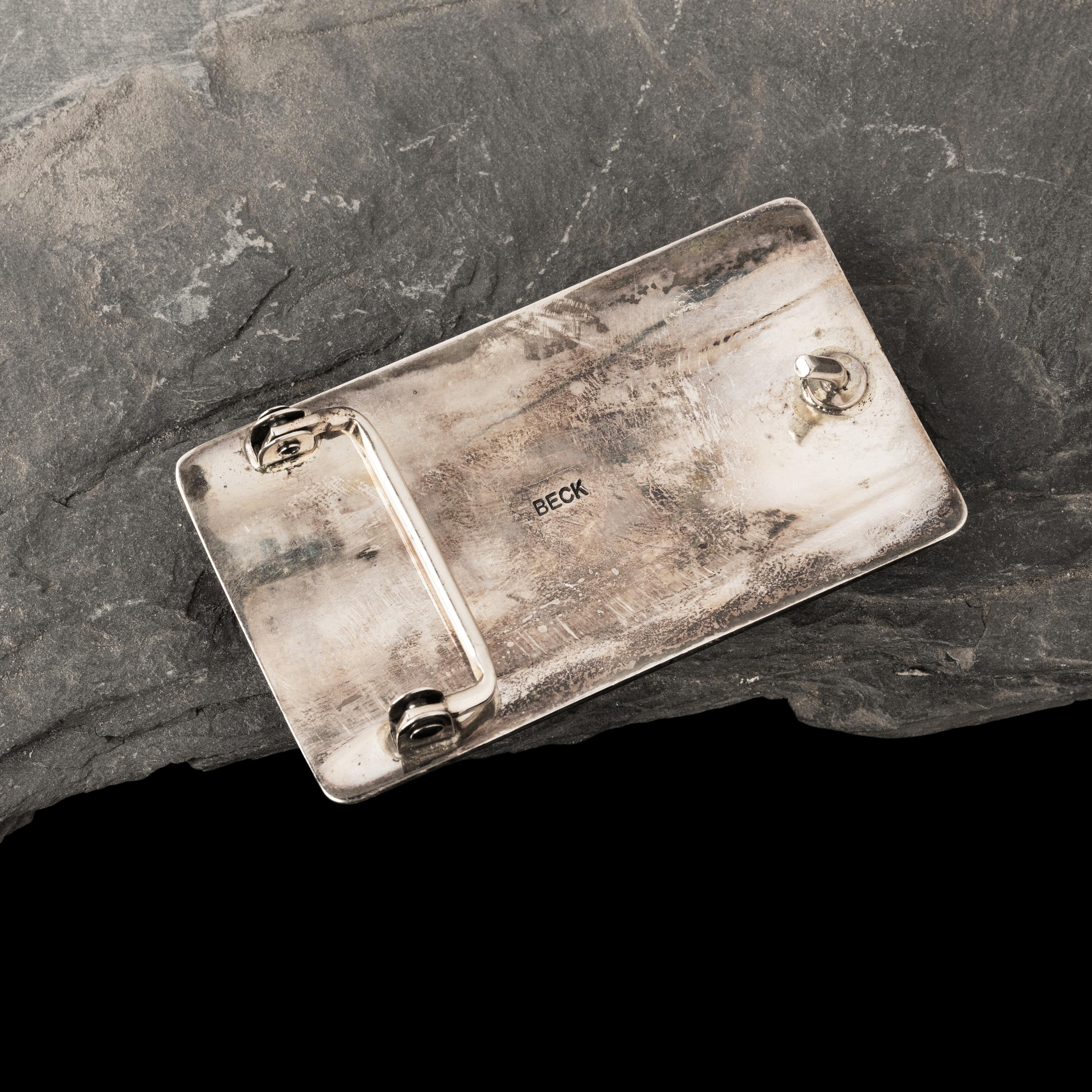 Victor Beck (Diné, 1941-2022) — Fluted Silver Belt Buckle with Inlay