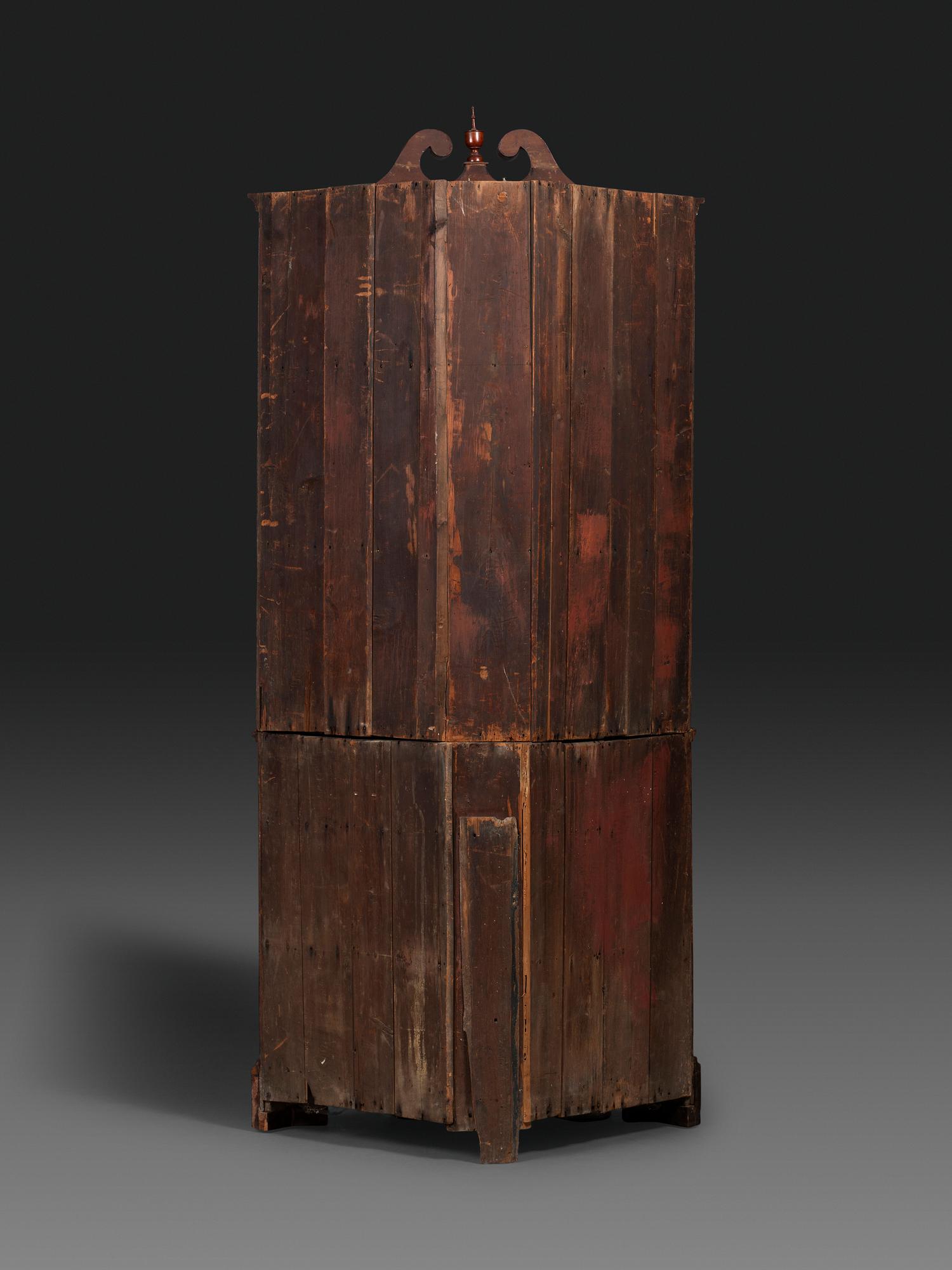 A Late Chippendale Carved Cherrywood Corner Cupboard