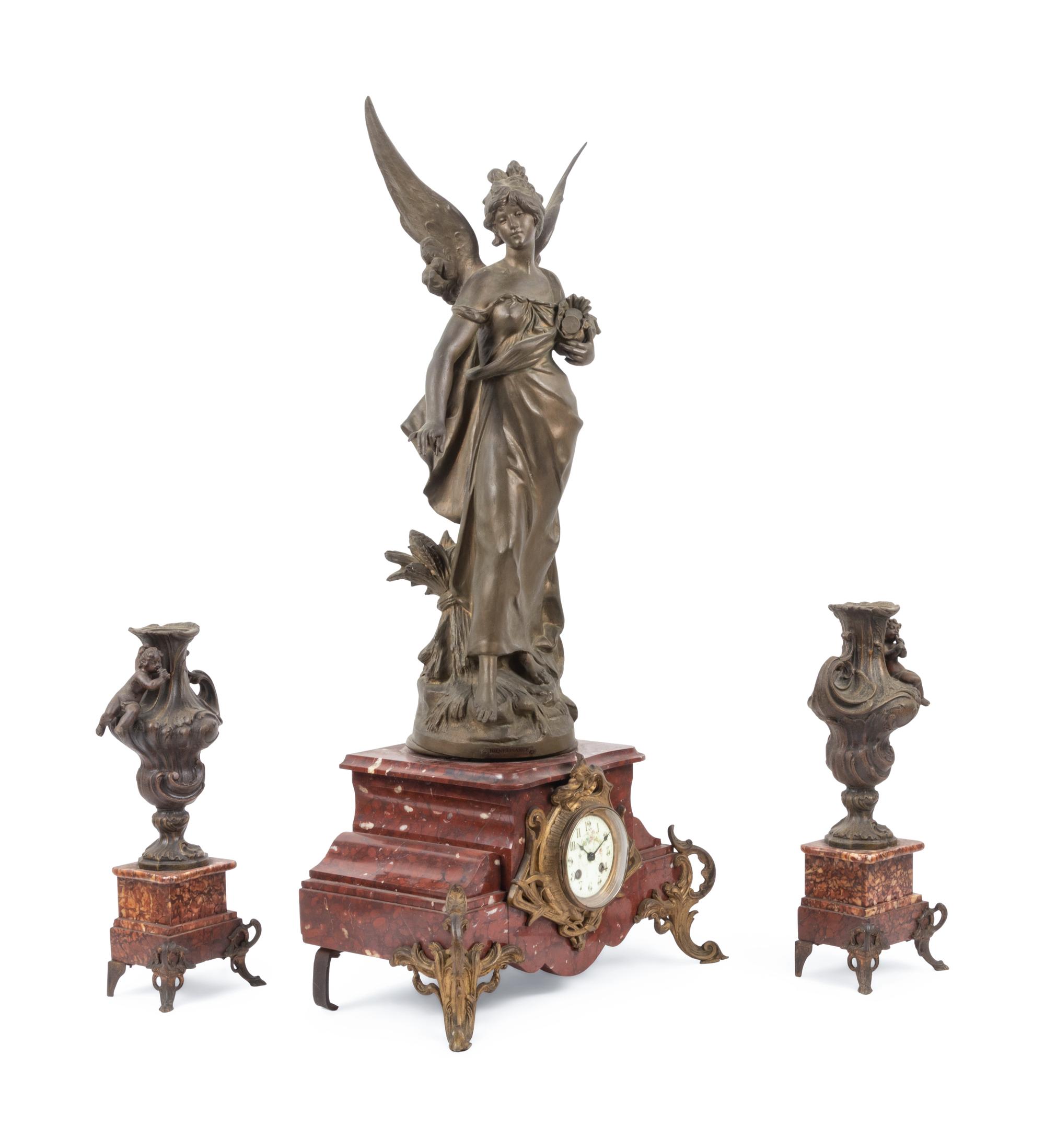 A French Cast Metal and Marble Clock Garniture
