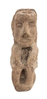 An Aztec Carved Stone Figure. Height 11 1/4 x width 3 3/4 x depth 5 3/4 inches.