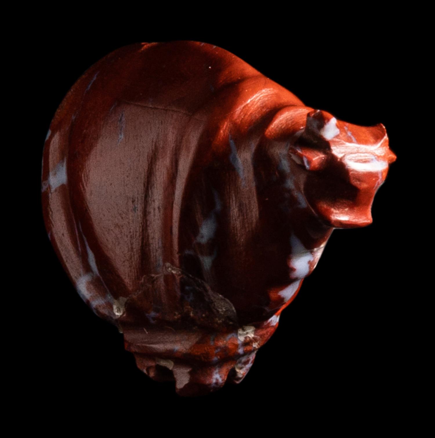 An Egyptian Red Jasper Trussed Ox