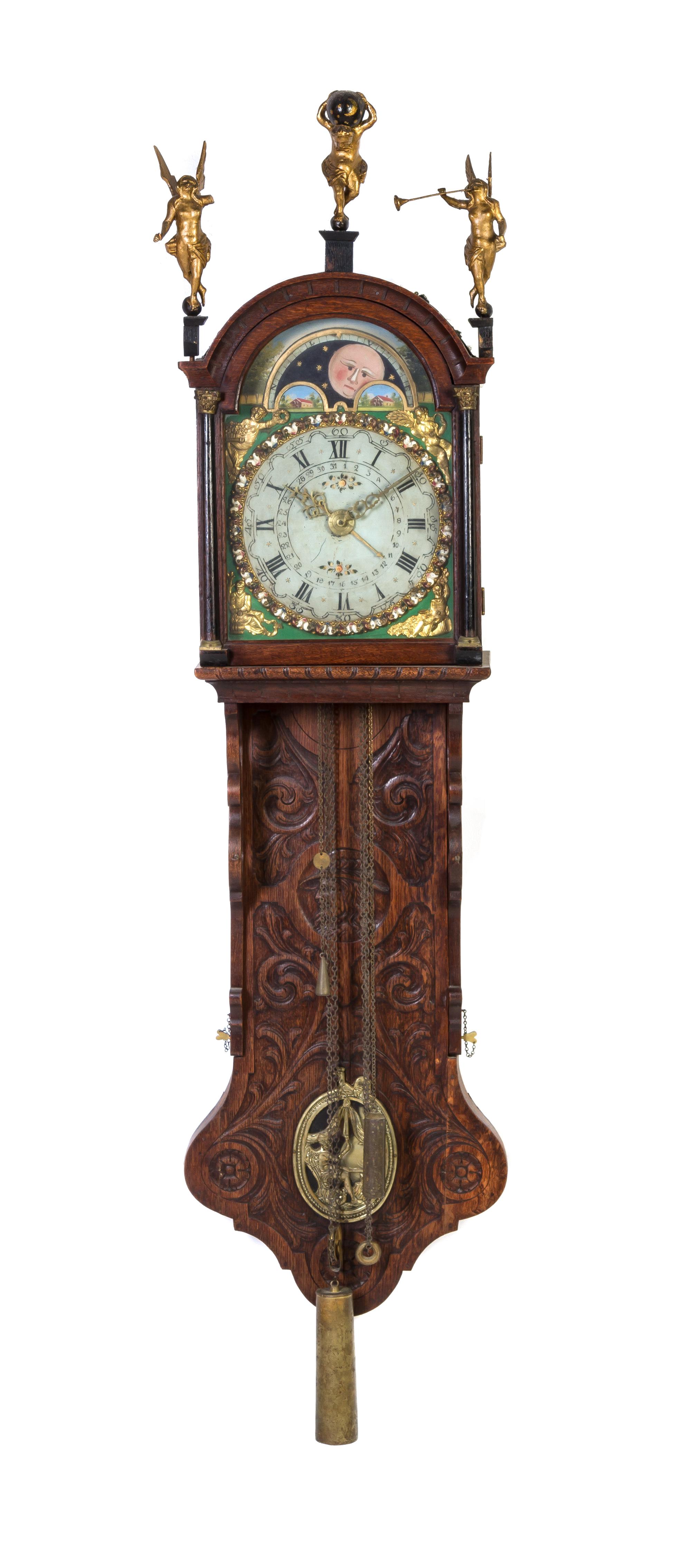 A Dutch Carved Oak Bracket Clock, Height 60 inches.