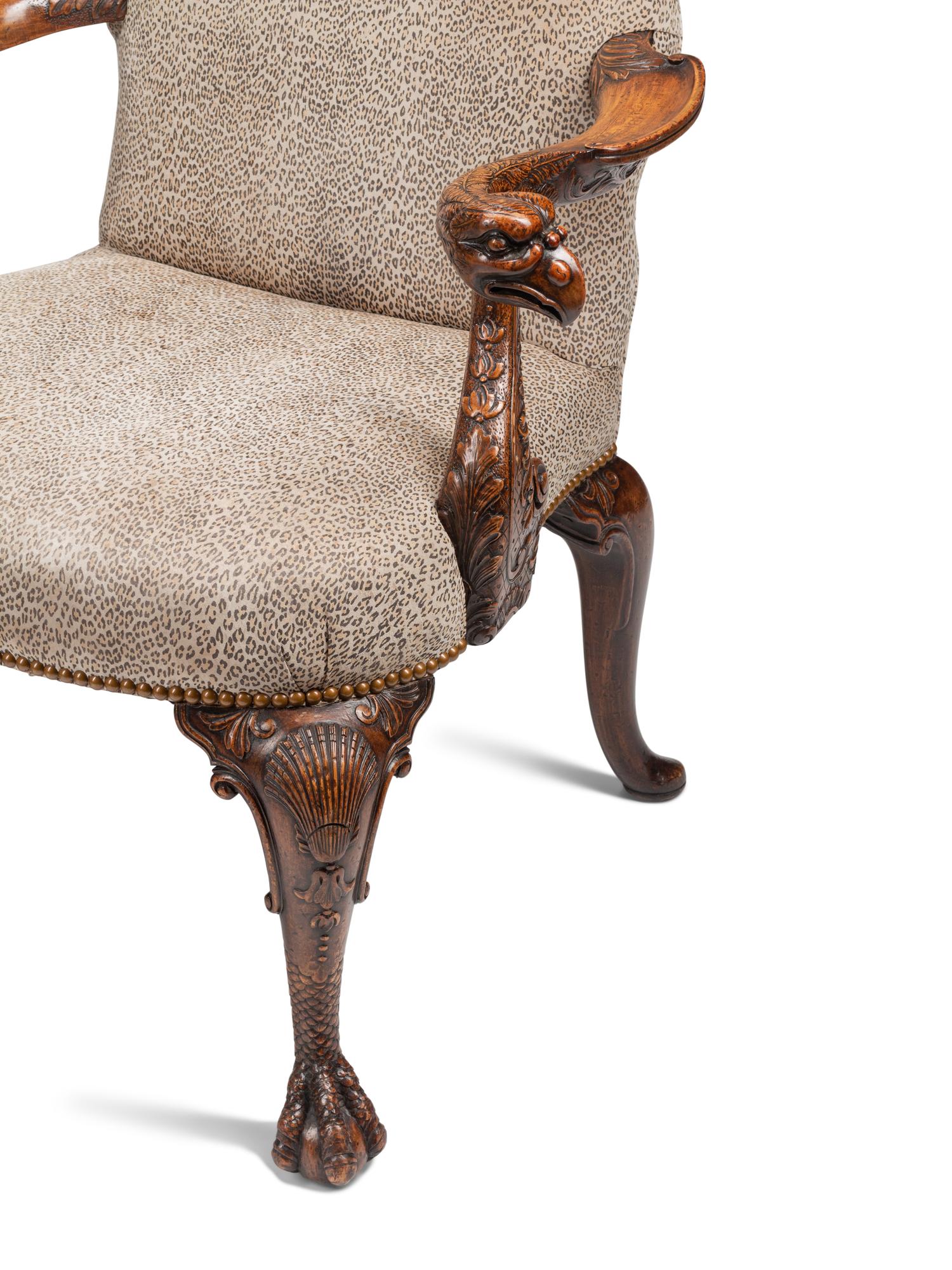 A Pair of George III Style Carved Walnut Library Armchairs