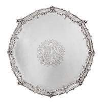 A George III Silver Salver, Maker's Mark I Pellet C, London 1771, shaped circular form with a beaded rim, the border chased with bellfl