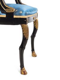 Two Empire Style Parcel Gilt Ebonized Armchairs