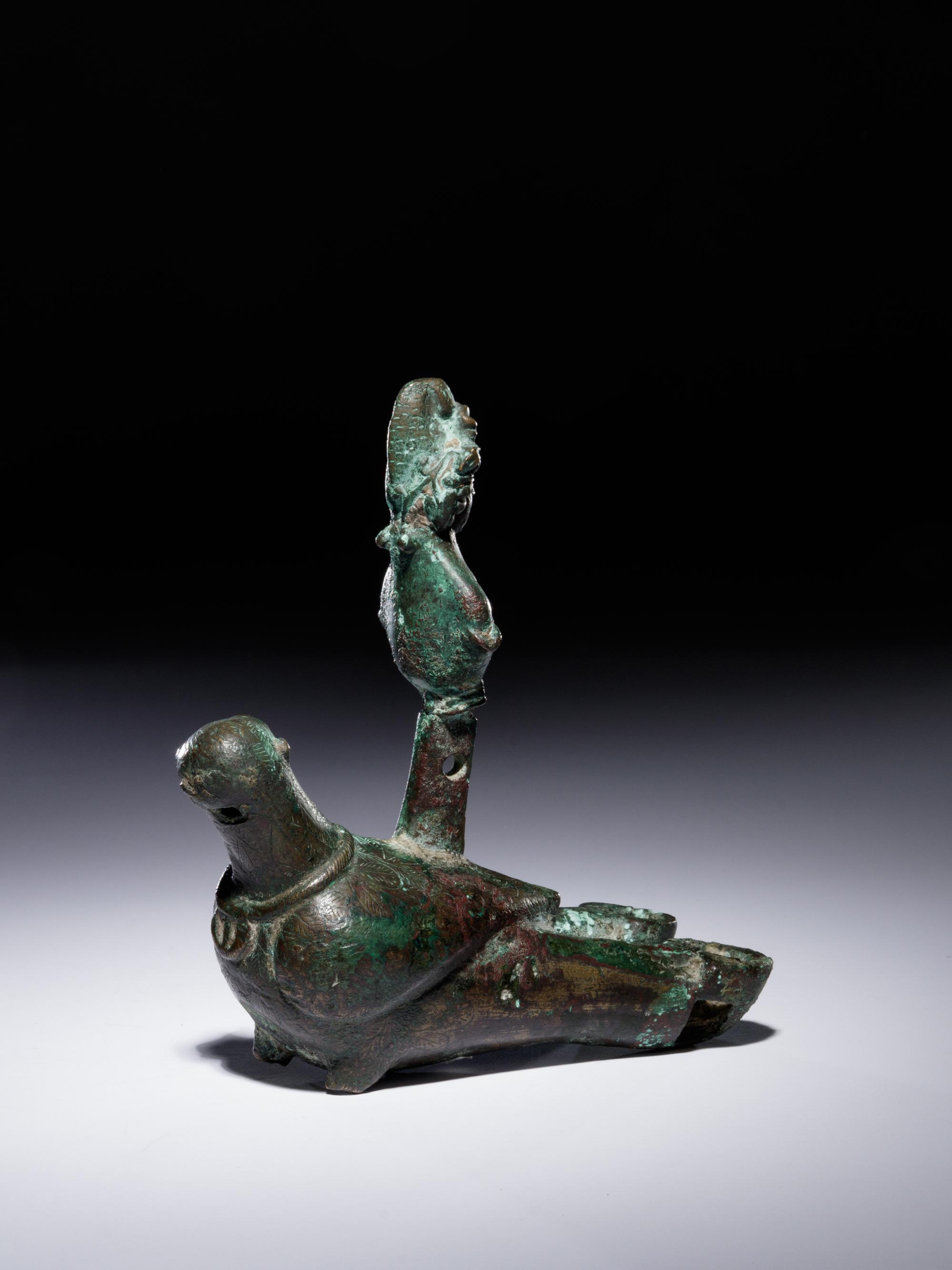 A Roman Bronze Oil Lamp in the Shape of a Dove with the Bust of a Goddess