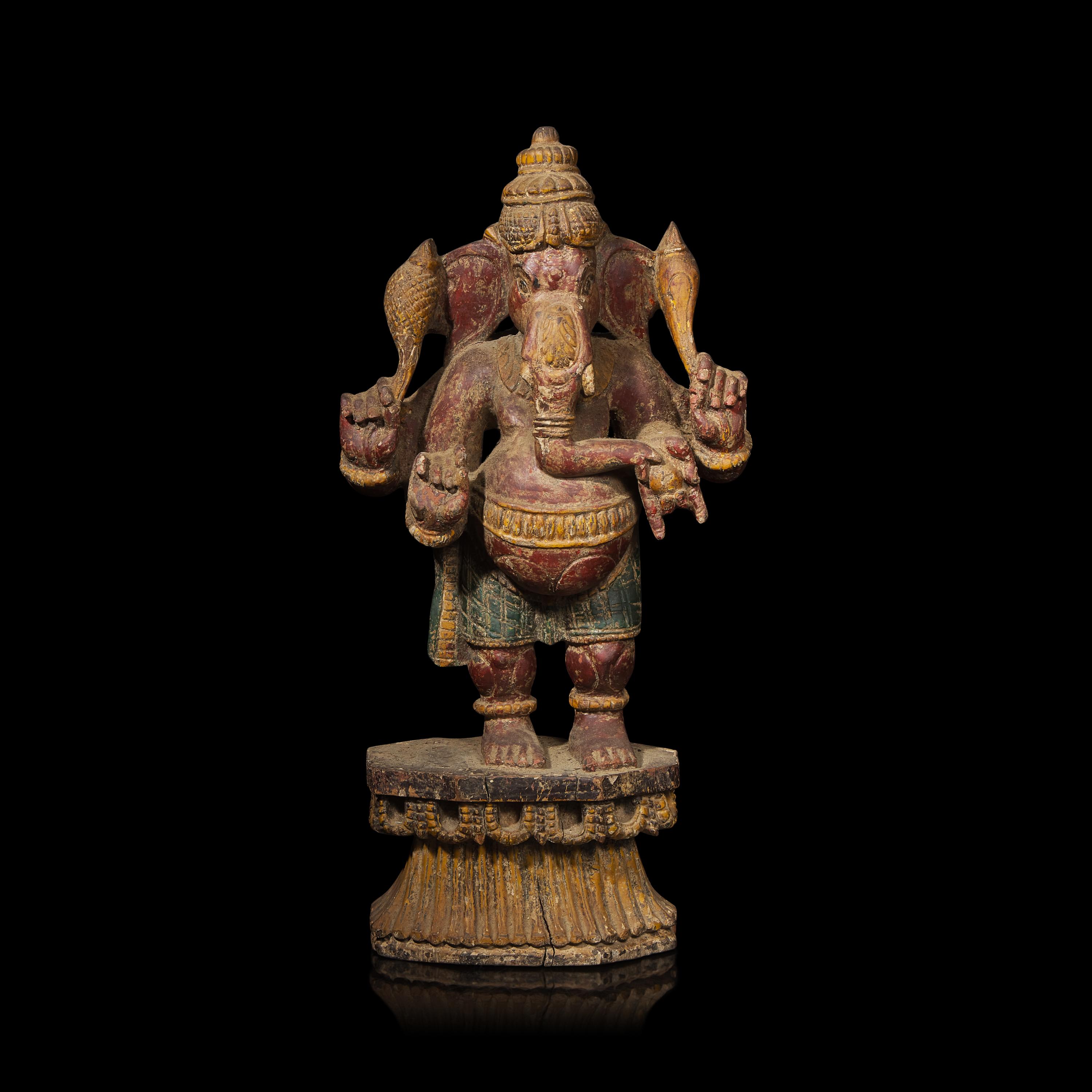An Indian Carved and Polychromed Wood Figure of Ganesh, Late 19th to Early 20th Century