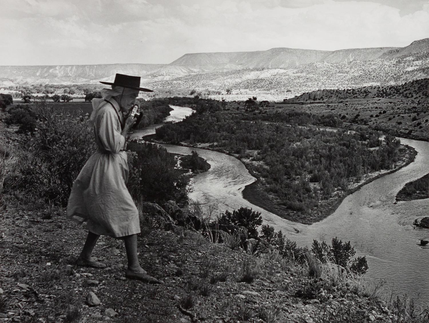 A group of four photographs ( O'Keeffe, Glen Canyon , 1961 (printed 1984); Georgia O'Keeffe Photographing the Chama River , 1961 (printed 1984); Untitled (O'Keeffe walking towards building) , 1960s; Untitled (O'Keeffe walking from building ), 1959 (printed 1984))