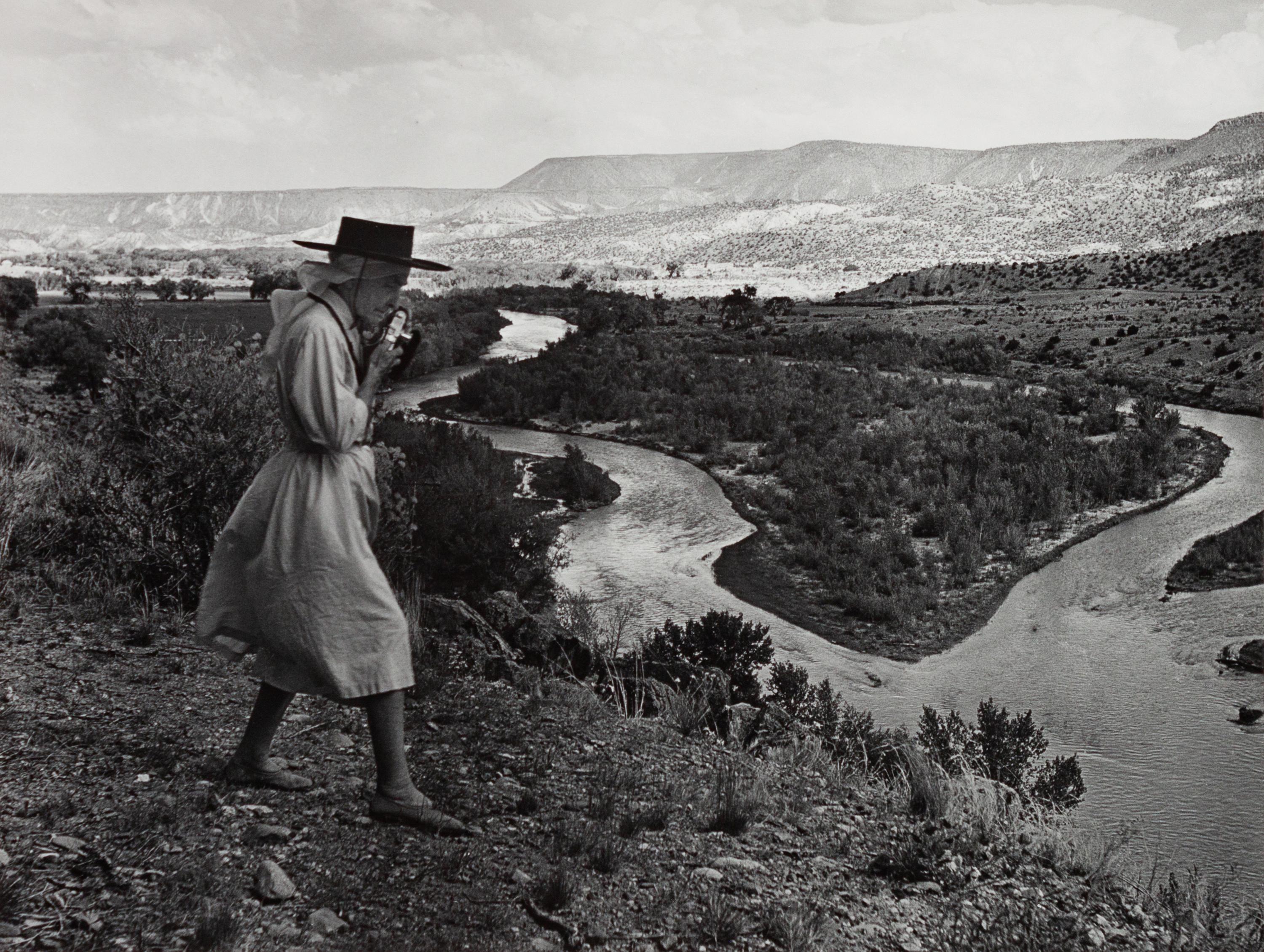 A group of four photographs ( O'Keeffe, Glen Canyon , 1961 (printed 1984); Georgia O'Keeffe Photographing the Chama River , 1961 (printed 1984); Untitled (O'Keeffe walking towards building) , 1960s; Untitled (O'Keeffe walking from building ), 1959 (printed 1984))