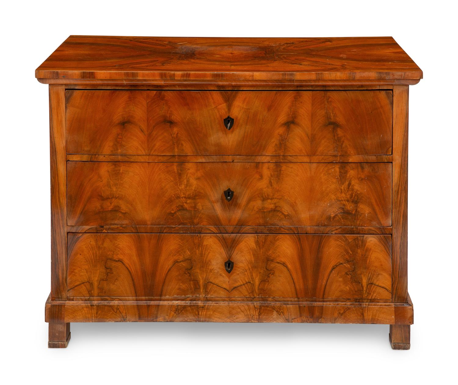 A Biedermeier Figured Walnut Commode
