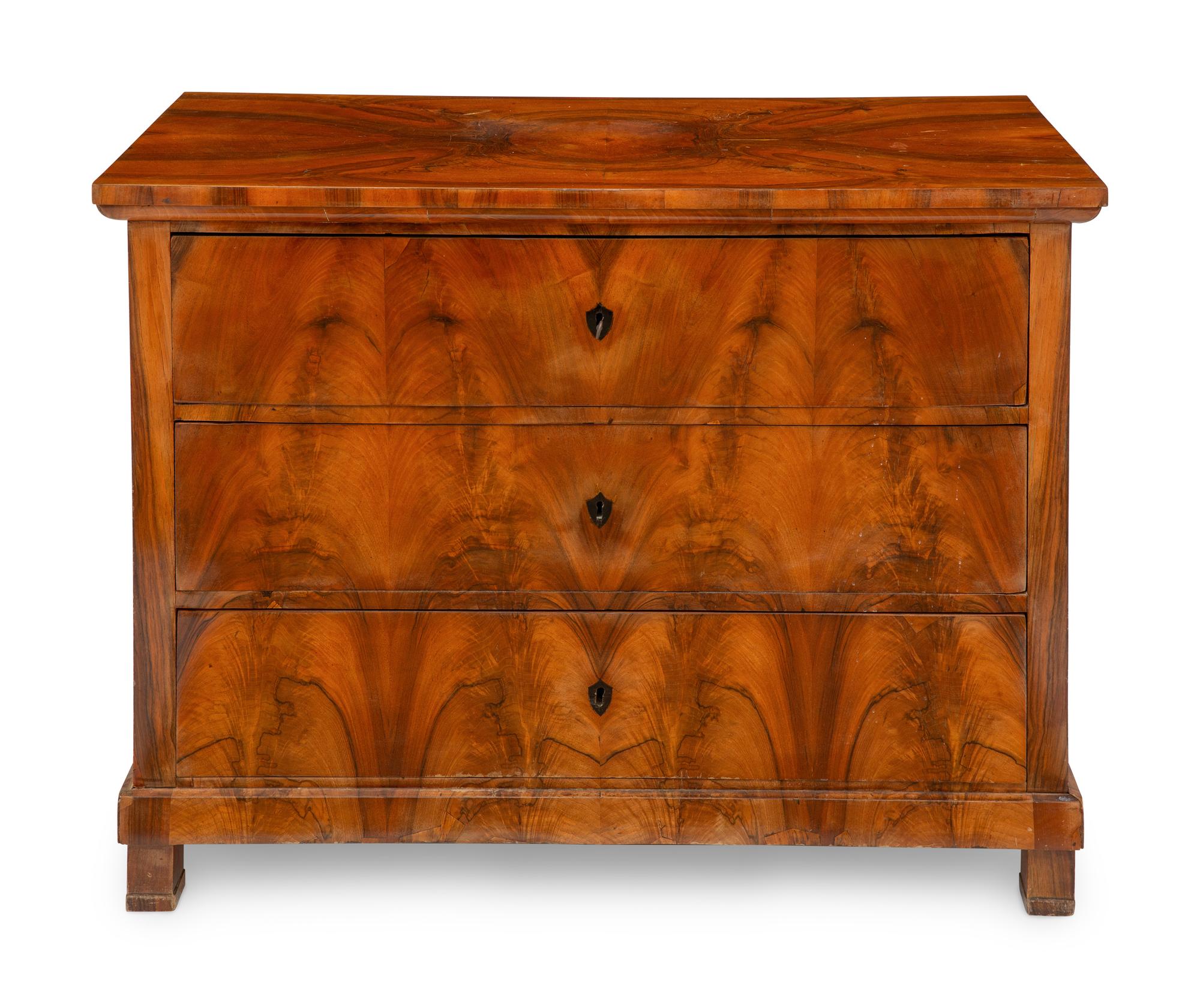 A Biedermeier Figured Walnut Commode