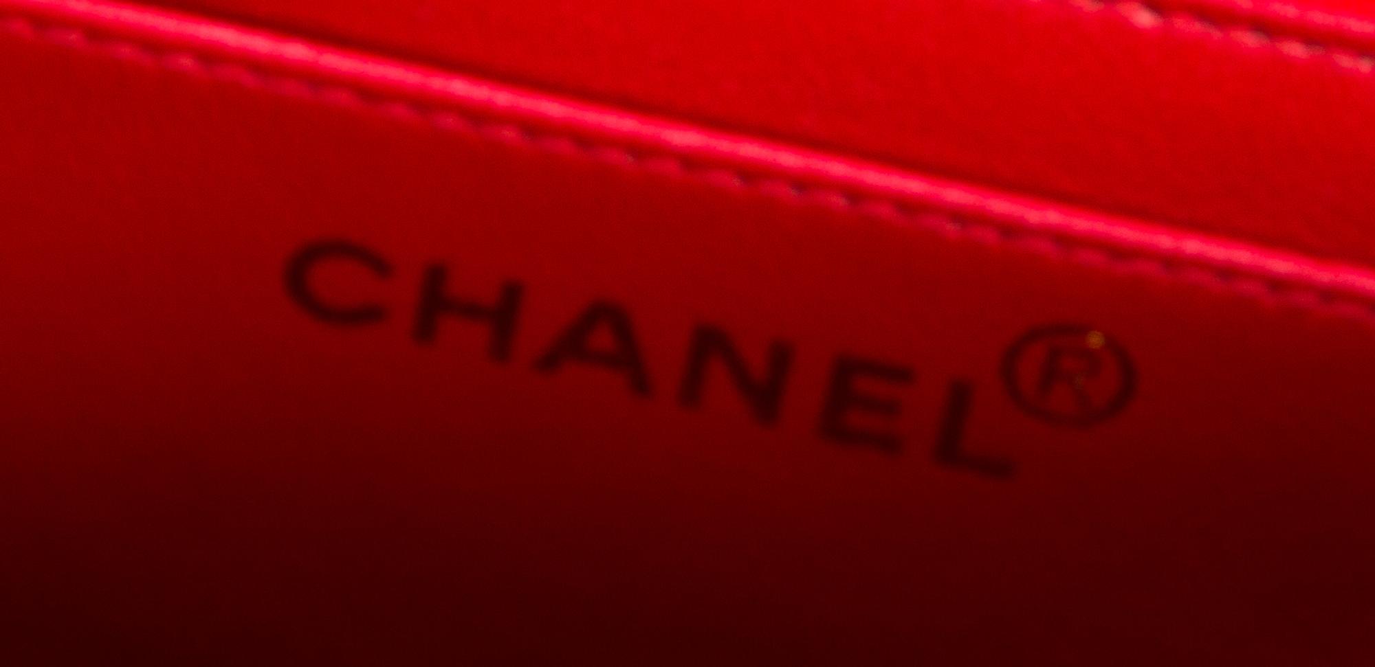 A Chanel Red Lambskin Quilted Flap Bag, 10" x 7" x 2.75"; Strap drop: 19".