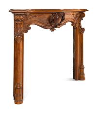 A Louis XV Style Carved Walnut Chimneypiece