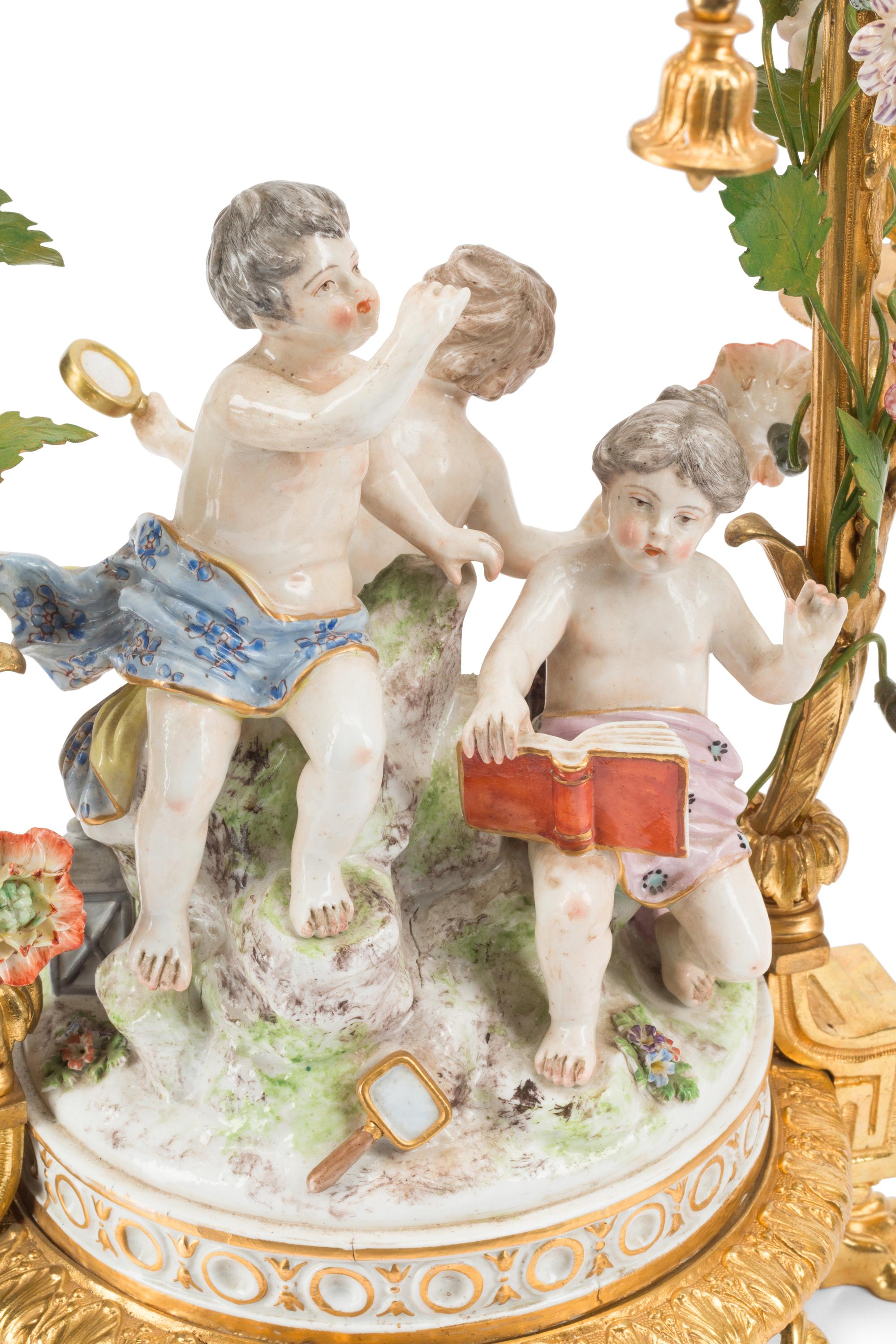 A Pair of French Gilt Bronze and Porcelain Figural Four-Light Candelabra