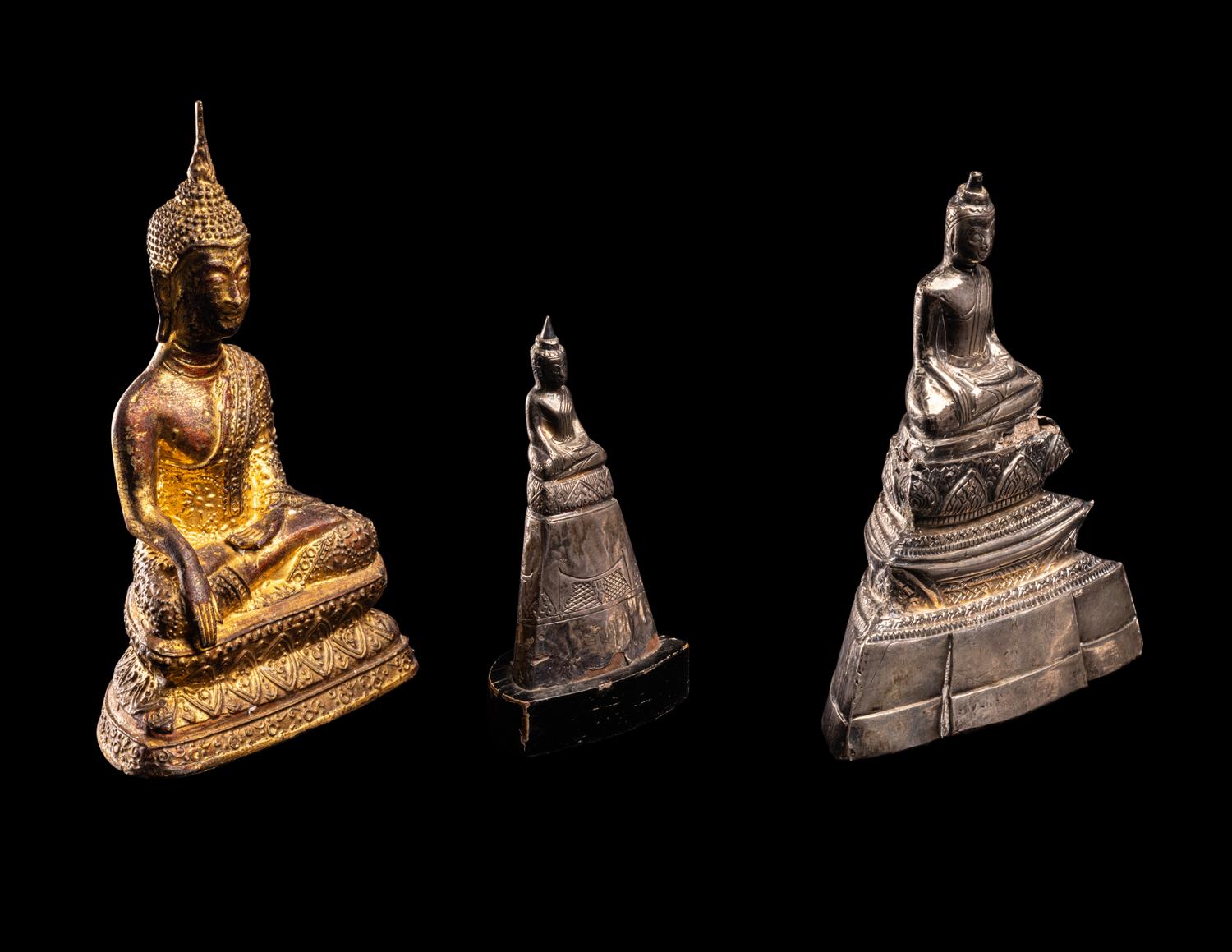 Three Thai Silver Veneered and Gilt Bronze Figures of Seated Buddha
