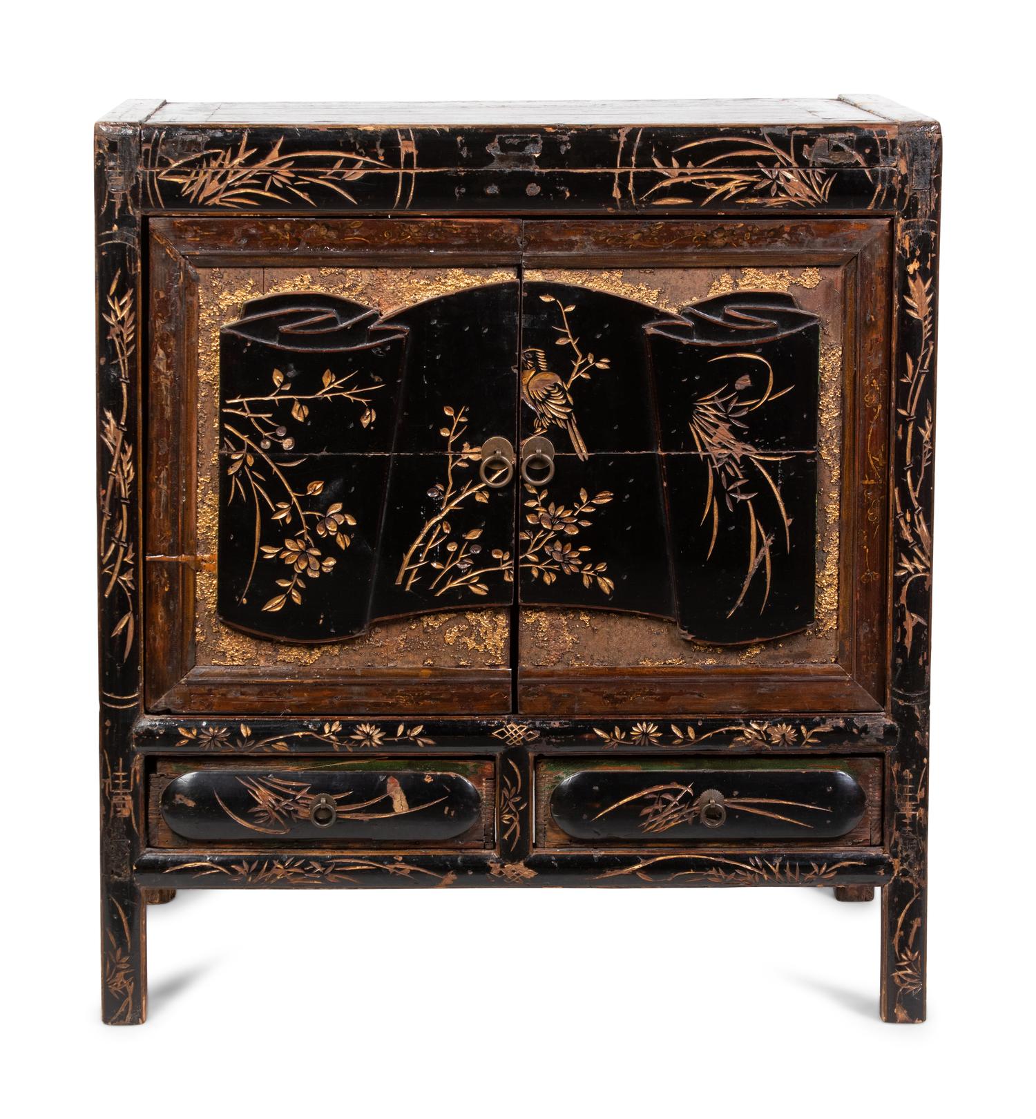 A Chinese Export Cabinet with Carved Lacquer Decoration