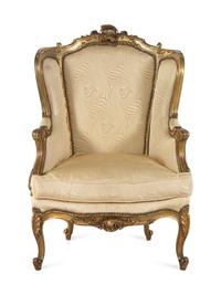 A Louis XV Style Carved Giltwood Bergère à Oreilles