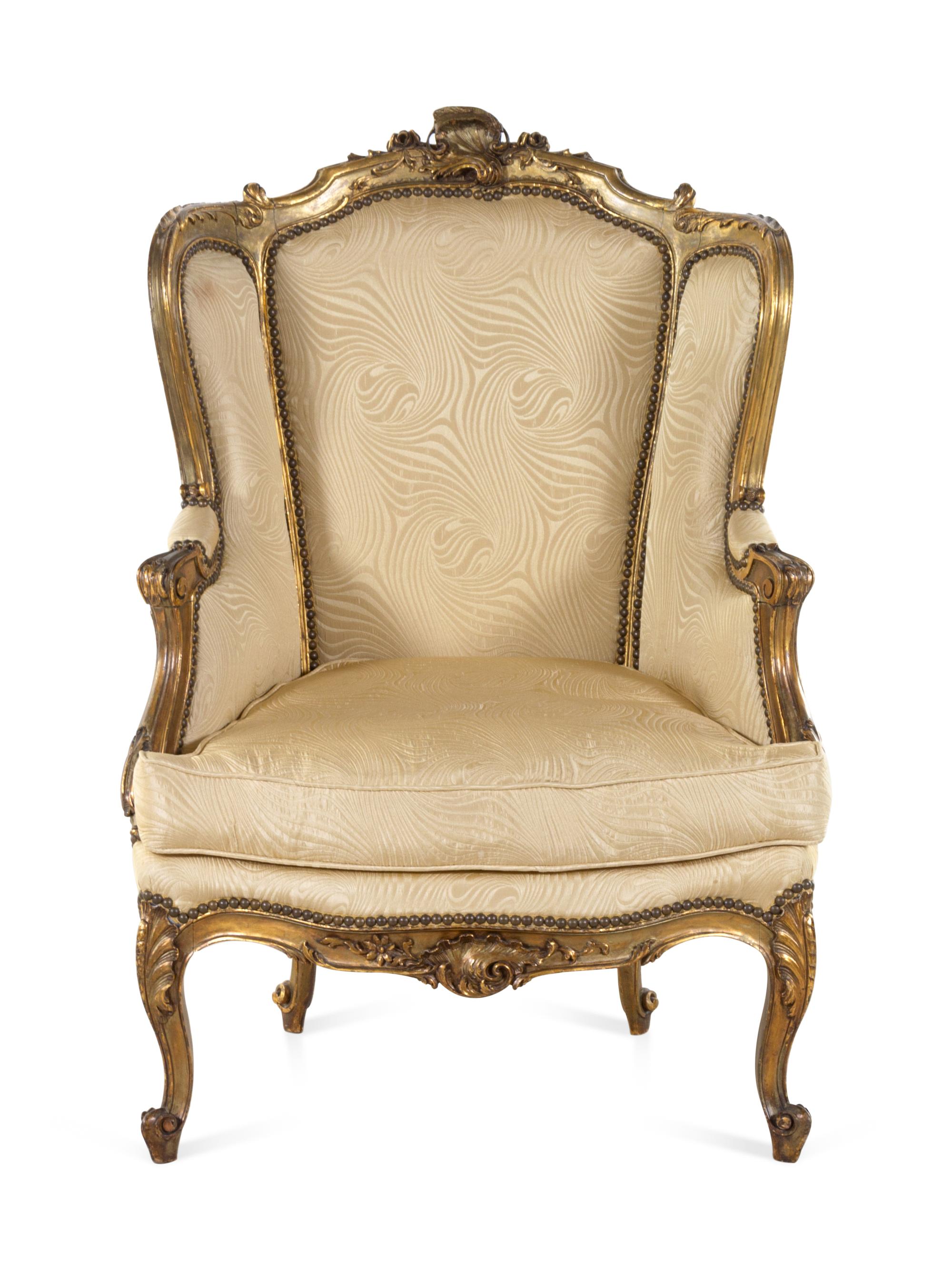A Louis XV Style Carved Giltwood Bergère à Oreilles