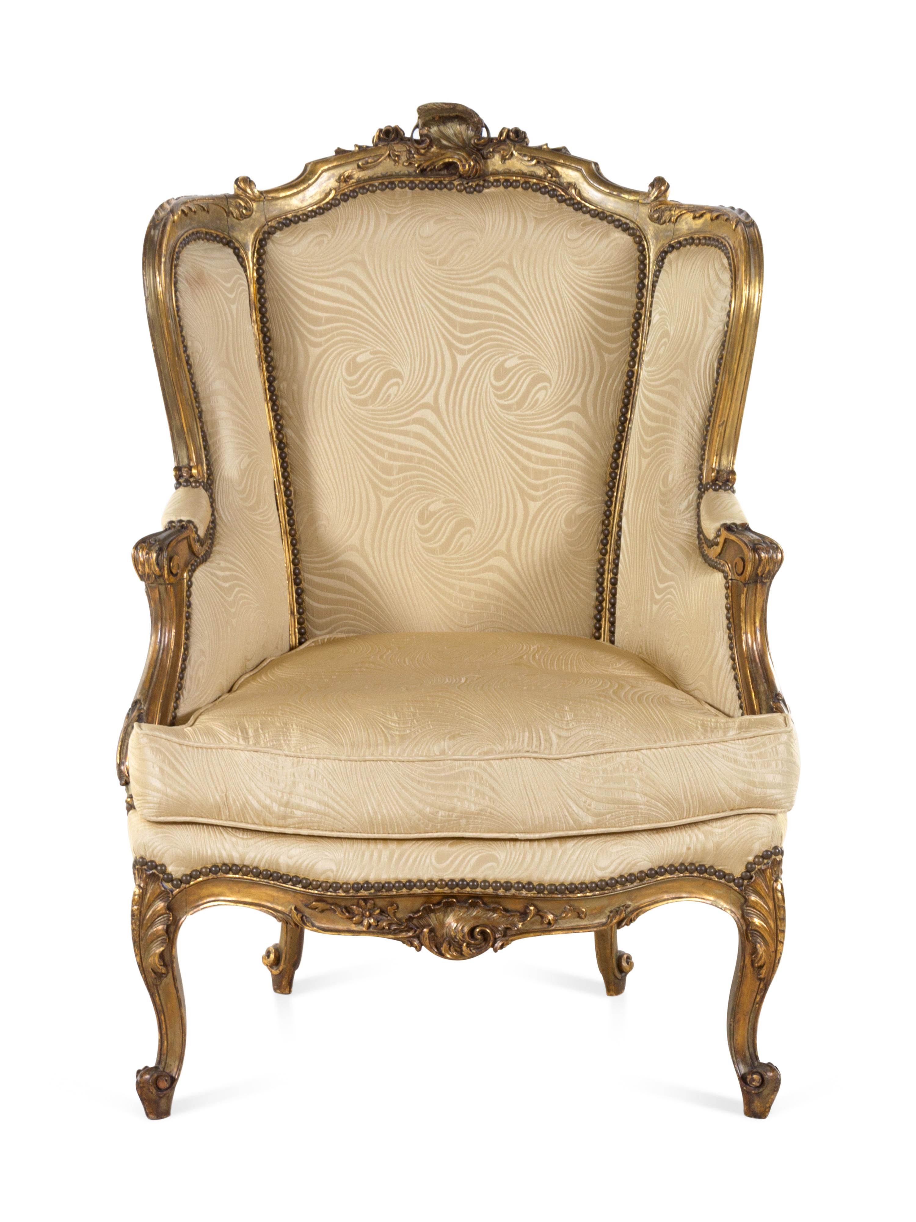 A Louis XV Style Carved Giltwood Bergère à Oreilles