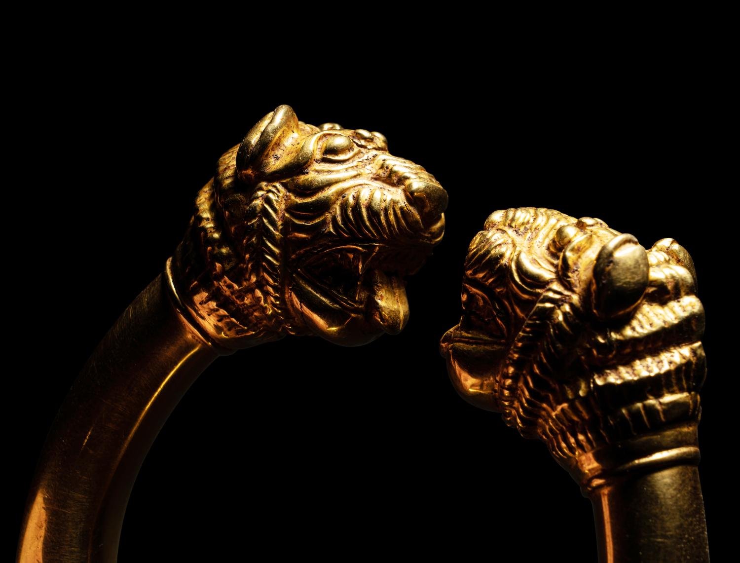 A Western Asiatic Gold Bracelet with Lion Headed Terminals