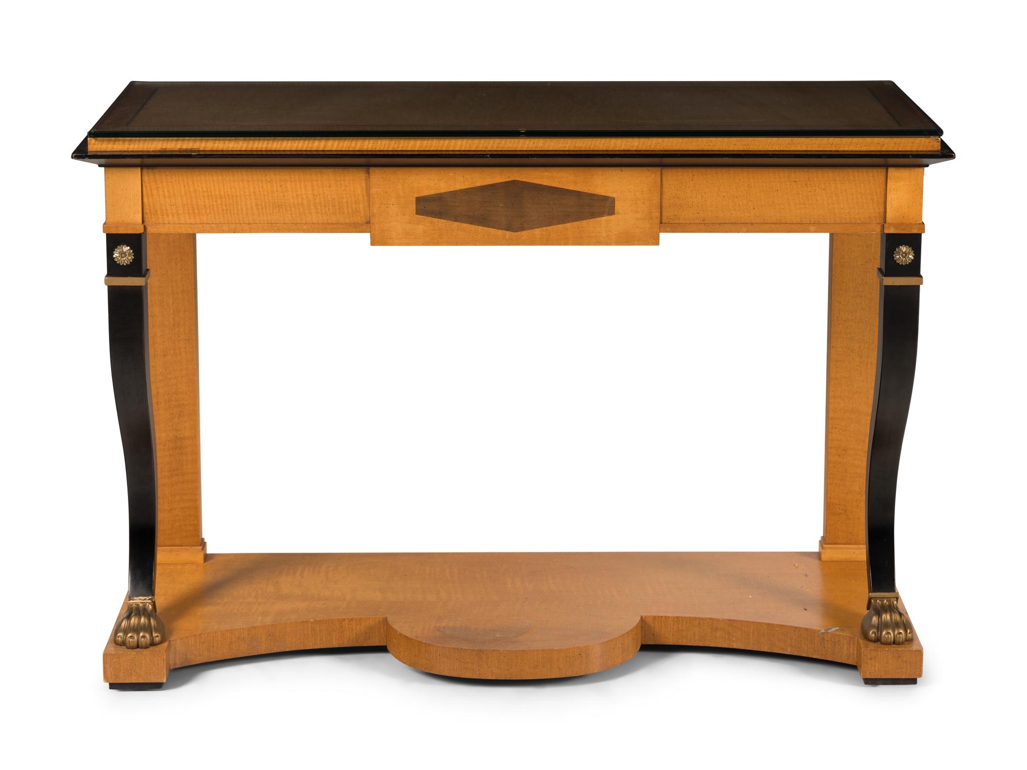 An Empire Style Parcel-Gilt and Ebonized Maple Console Table