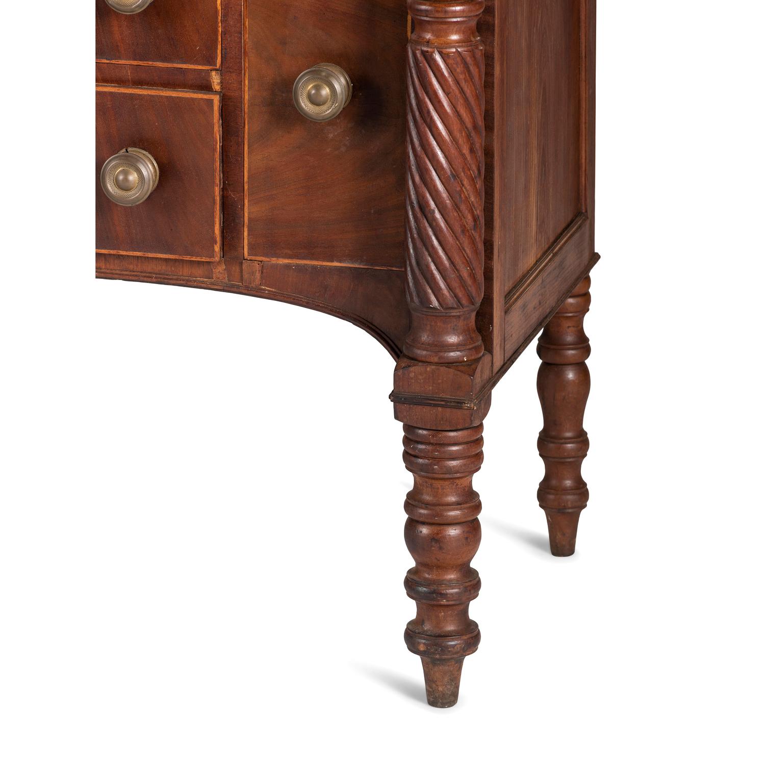 A Classical Figured Maple and Mahogany Desk-and-Bookcase