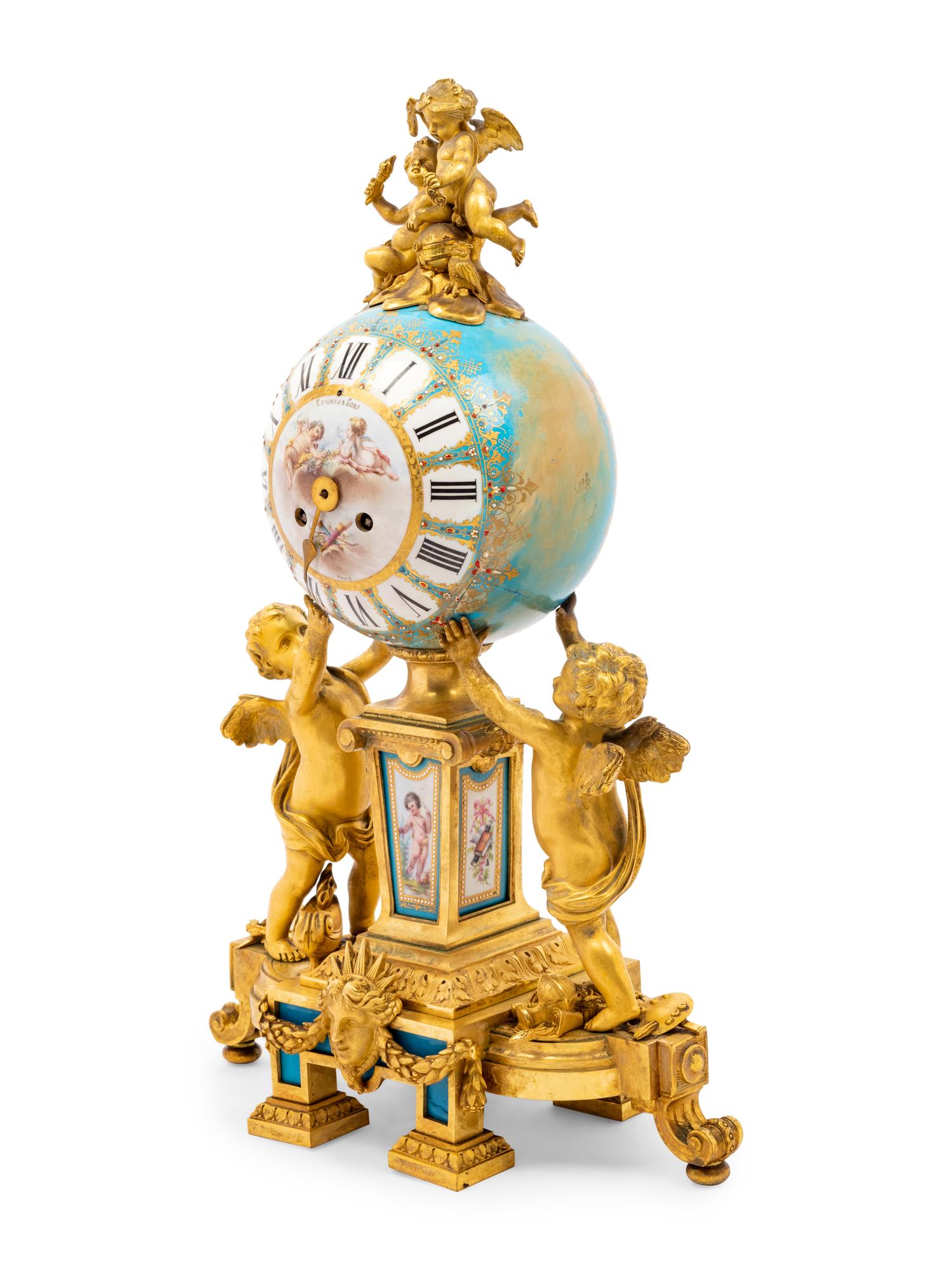 A Sèvres Style Porcelain and Gilt Bronze Mounted Three-Piece Clock Garniture