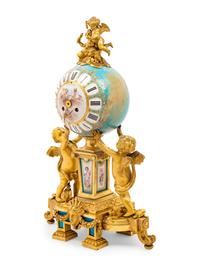 A Sèvres Style Porcelain and Gilt Bronze Mounted Three-Piece Clock Garniture