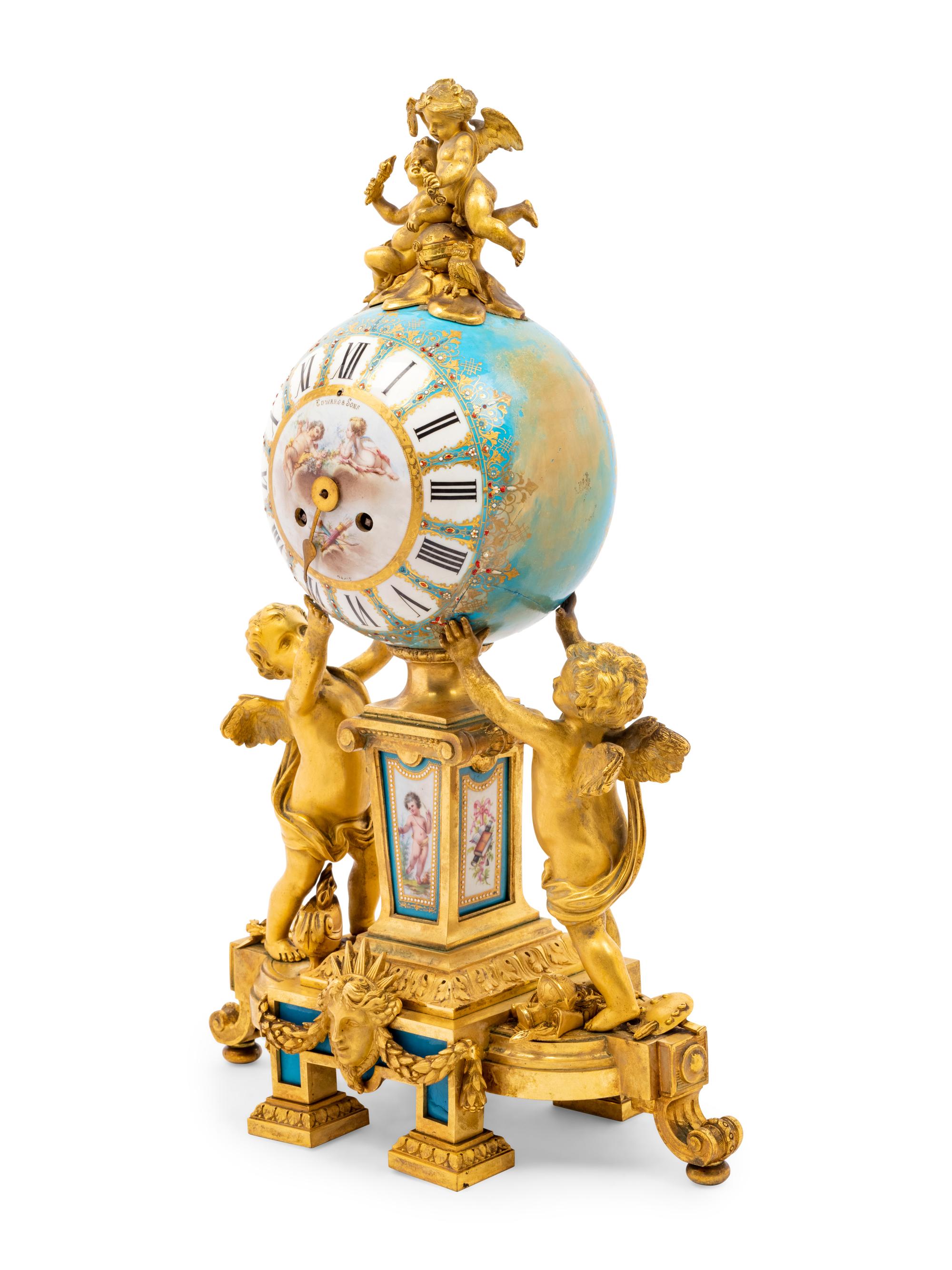 A Sèvres Style Porcelain and Gilt Bronze Mounted Three-Piece Clock Garniture