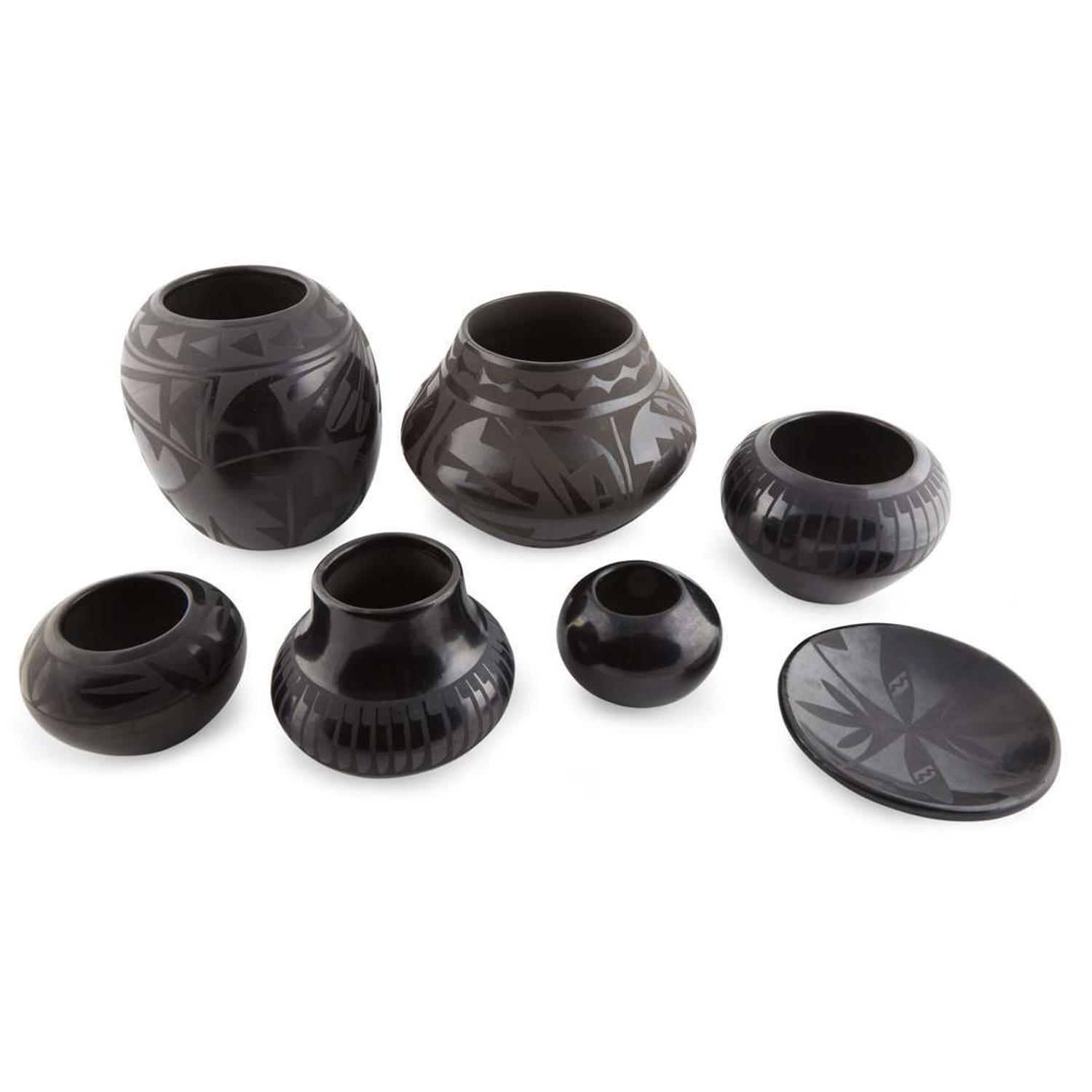 Group of seven Santa Clara and San Ildefonso blackware items 20th century