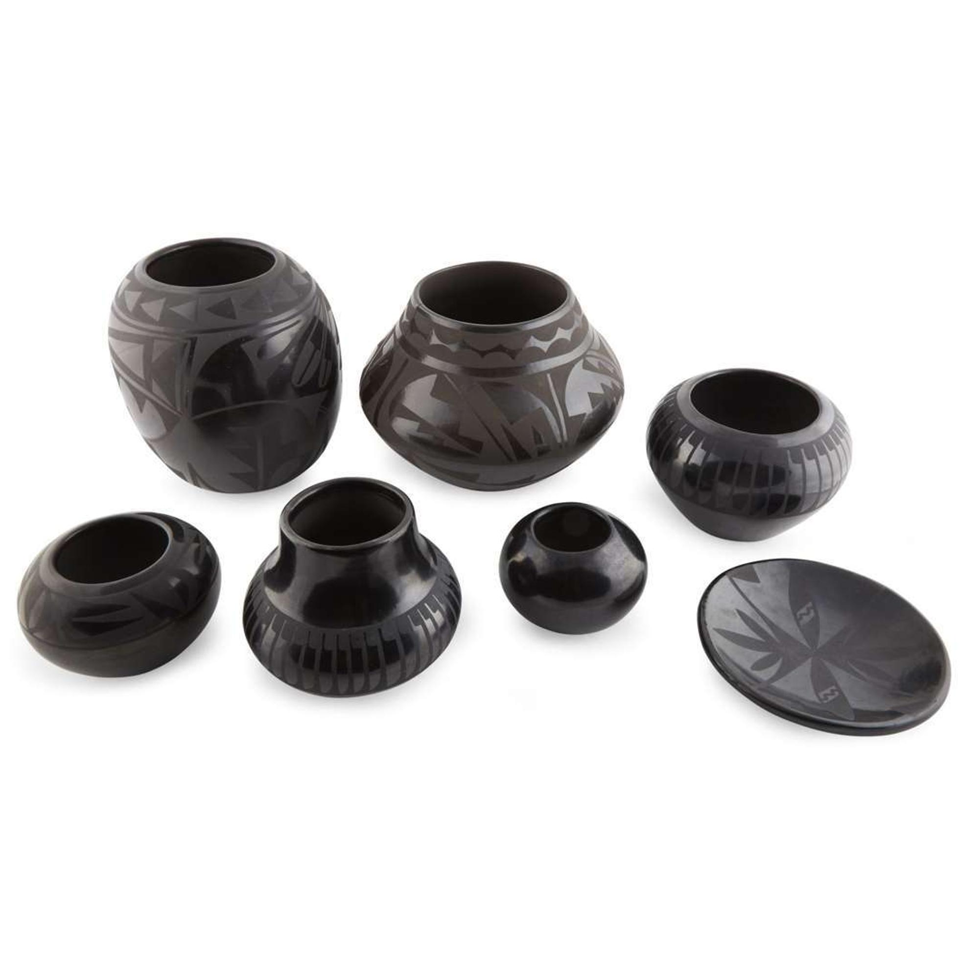 Group of seven Santa Clara and San Ildefonso blackware items 20th century