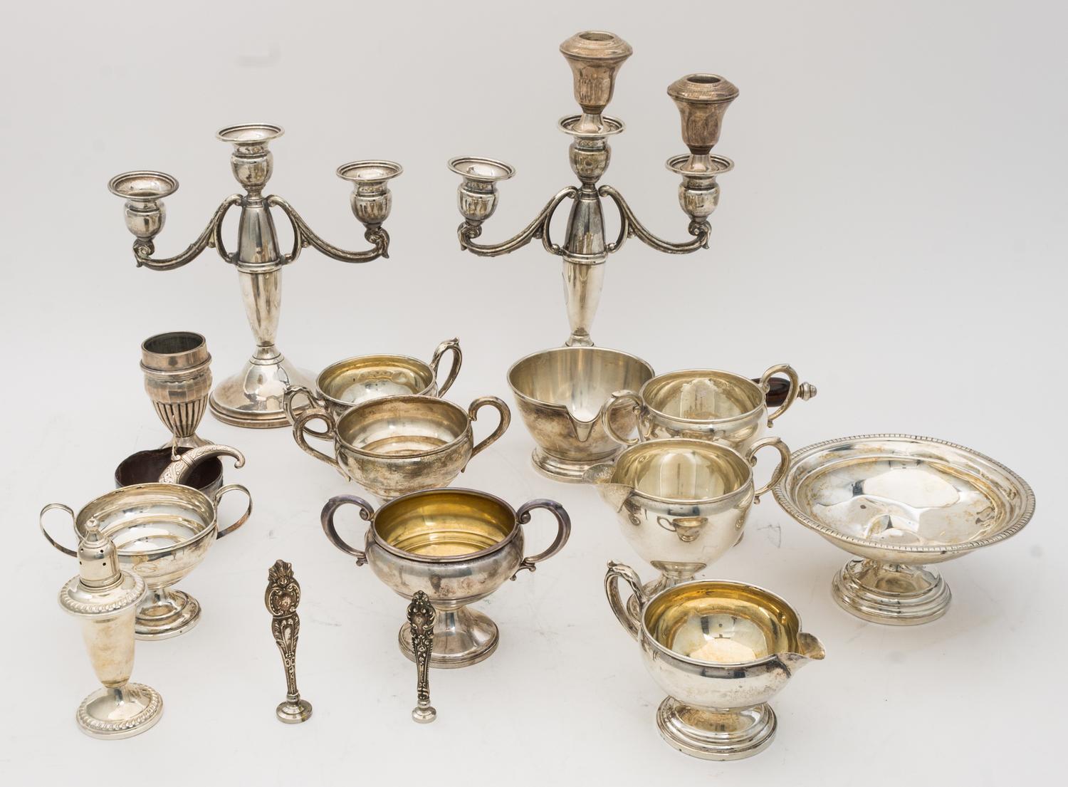 A Collection of Weighted Silver Table Articles, various makers, comprising candlesticks, tazze, creamers, vases, casters and bowls.