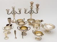 A Collection of Weighted Silver Table Articles, various makers, comprising candlesticks, tazze, creamers, vases, casters and bowls.