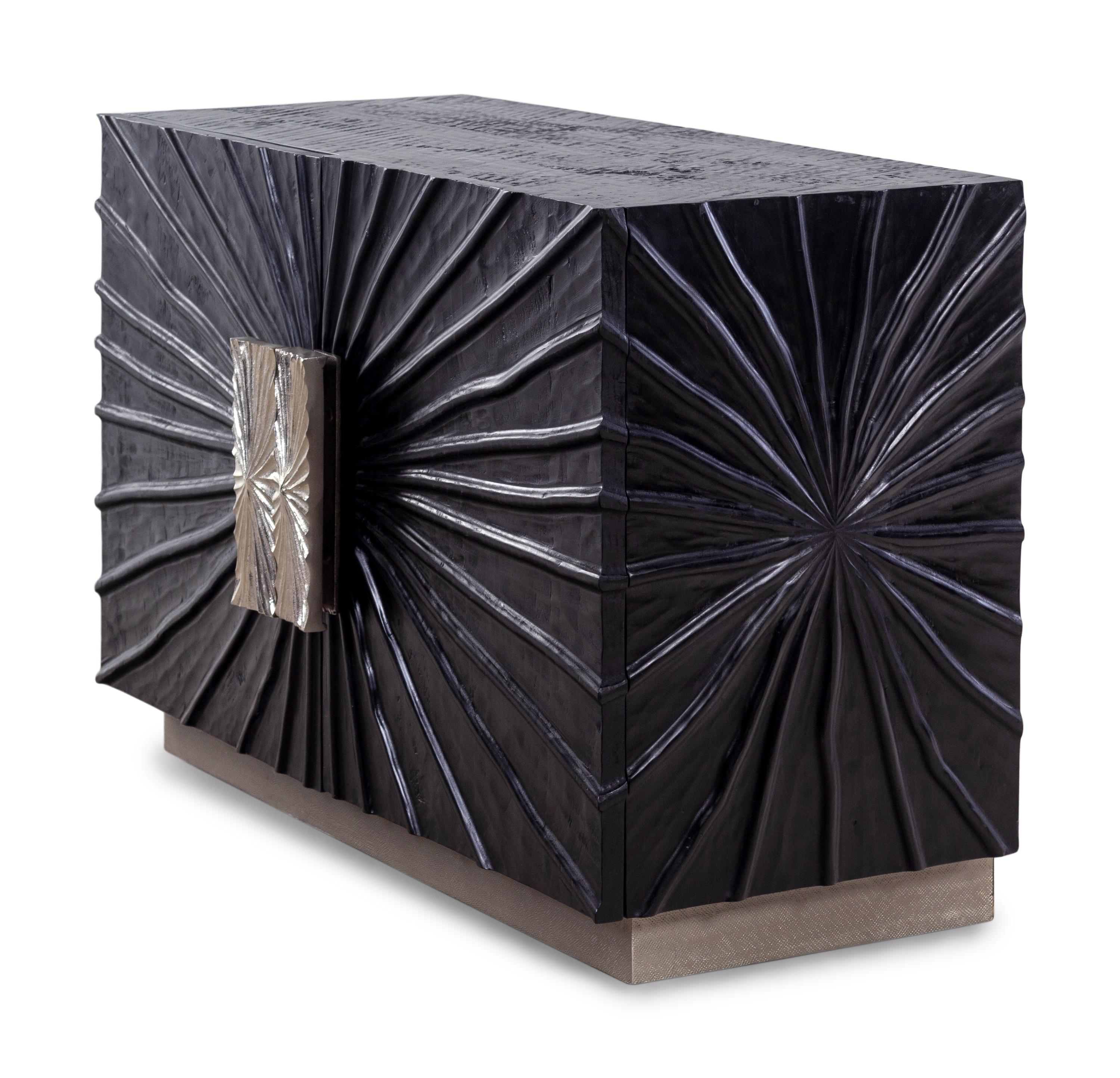 A Contemporary Ebonized Sculpture-Front Cabinet