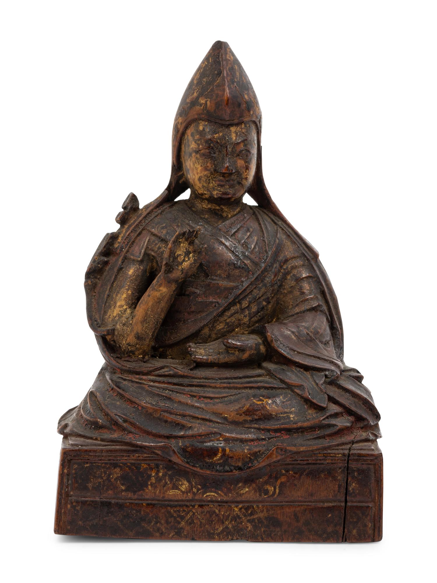 Three Sino-Tibetan Carved Wood Seated Figures
