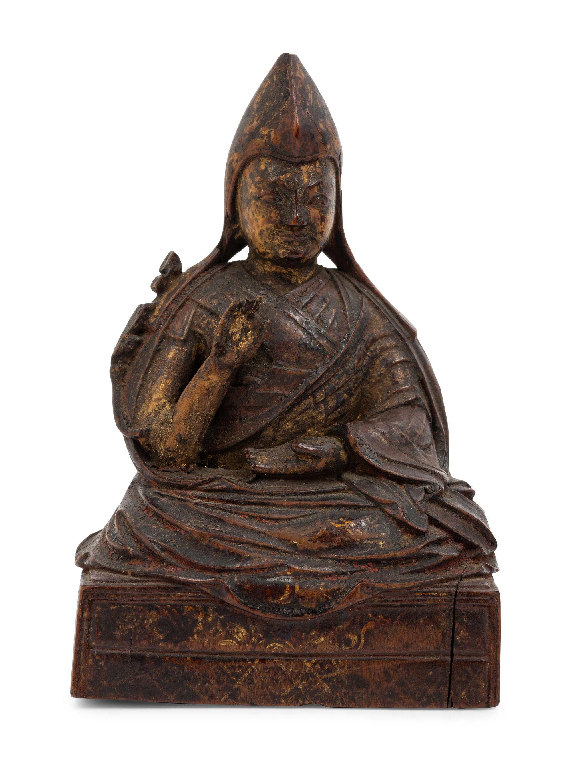 Three Sino-Tibetan Carved Wood Seated Figures
