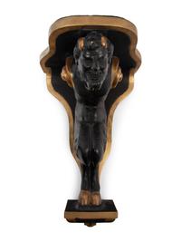 A Pair of Continental Ebonized and Parcel Gilt Wood Figural Brackets