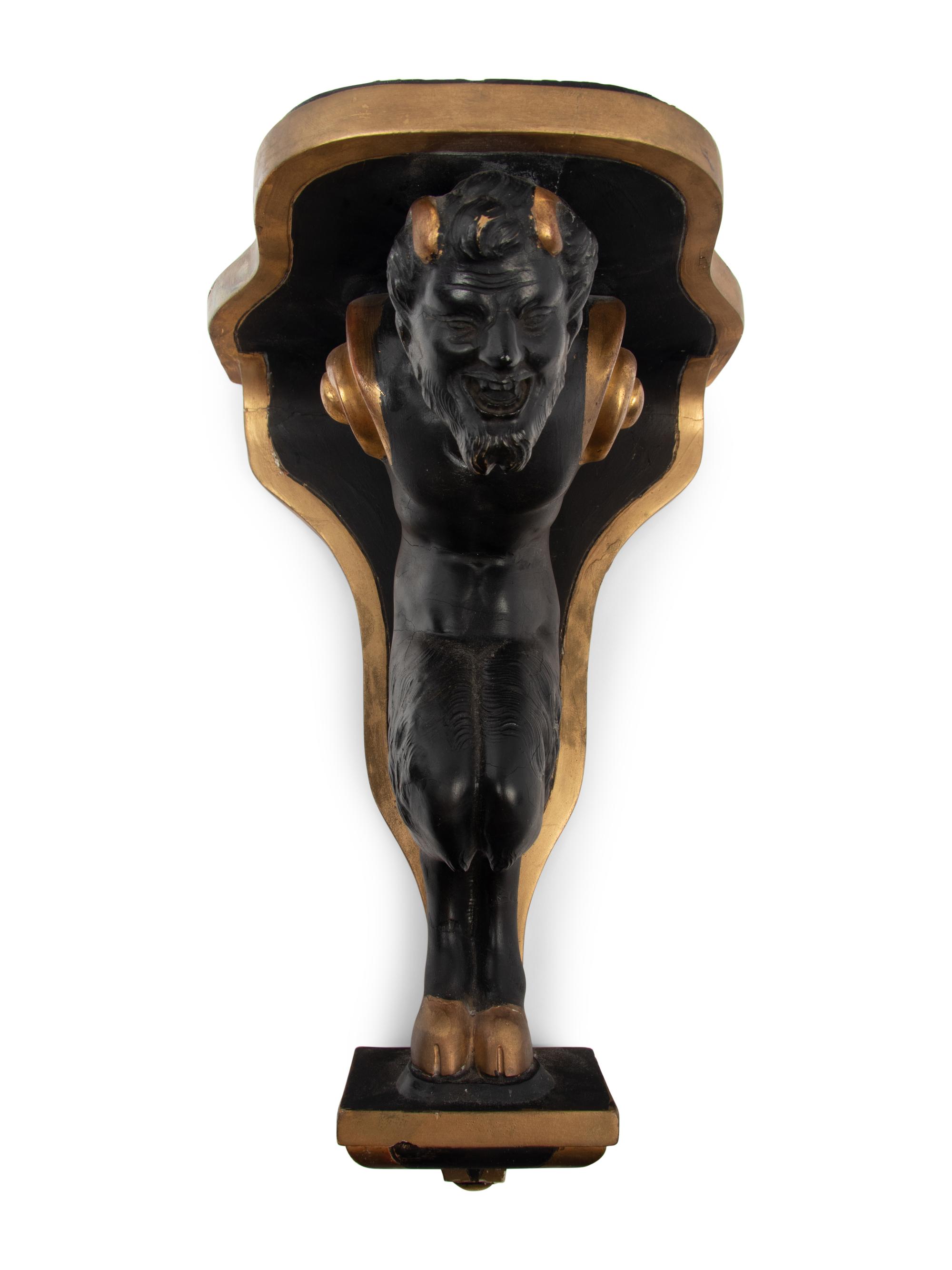A Pair of Continental Ebonized and Parcel Gilt Wood Figural Brackets