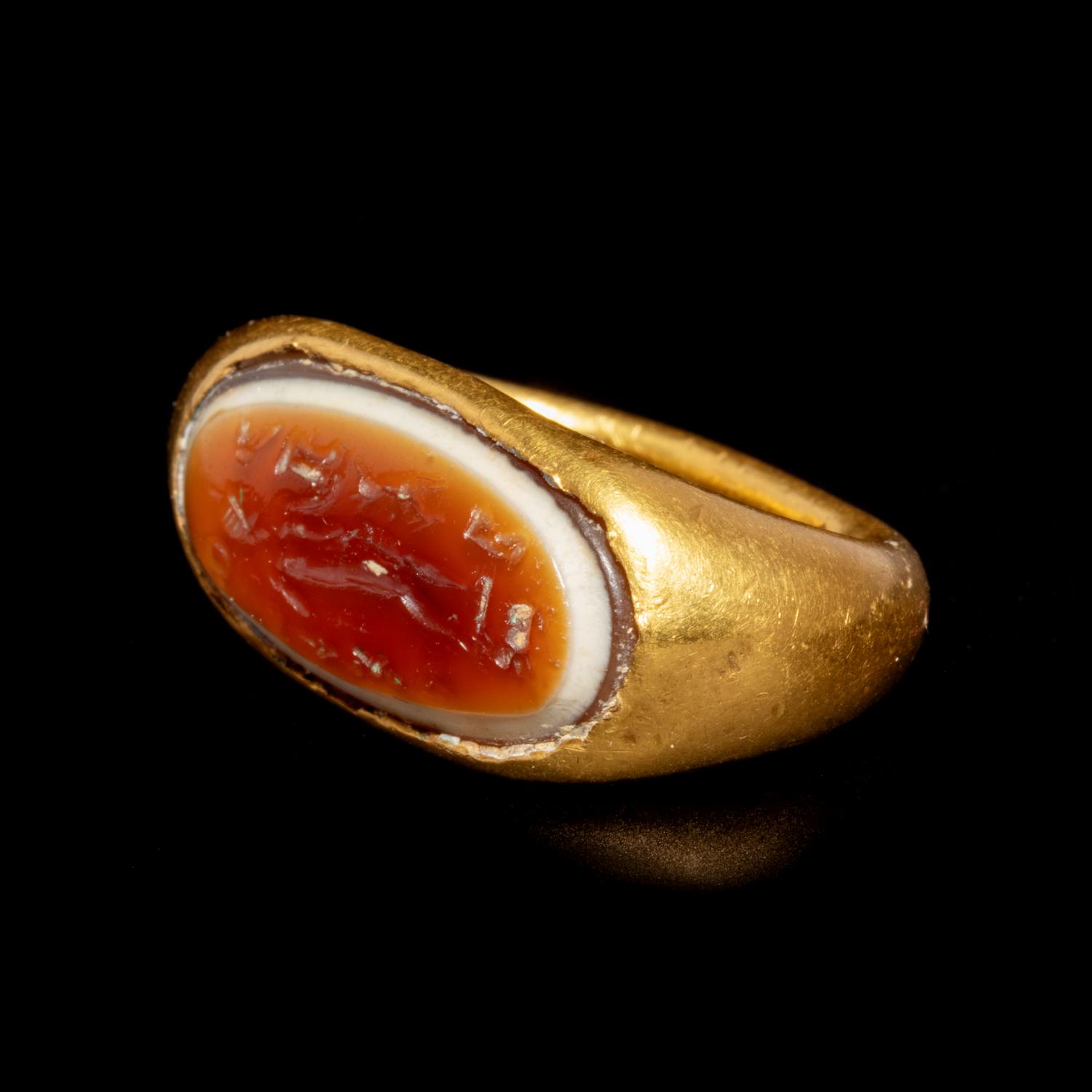 A Hellenistic Gold Finger Ring with Banded Agate Intaglio of Nude Deity